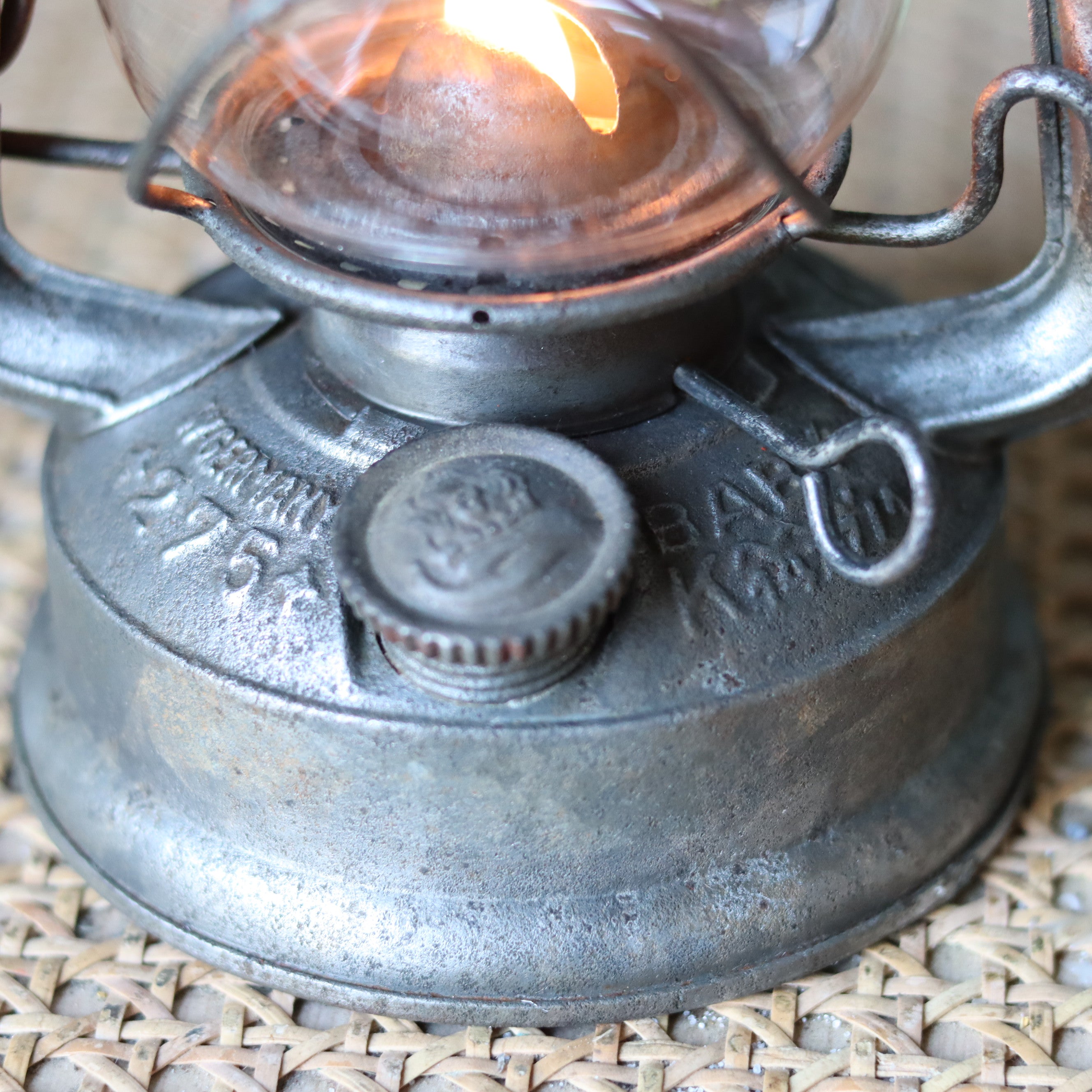 Vintage Feuerhand Baby 275 Hurricane Lantern – Western Germany, 1950s, Karlsruhe Marking close-up of metal oil lamp base and flame