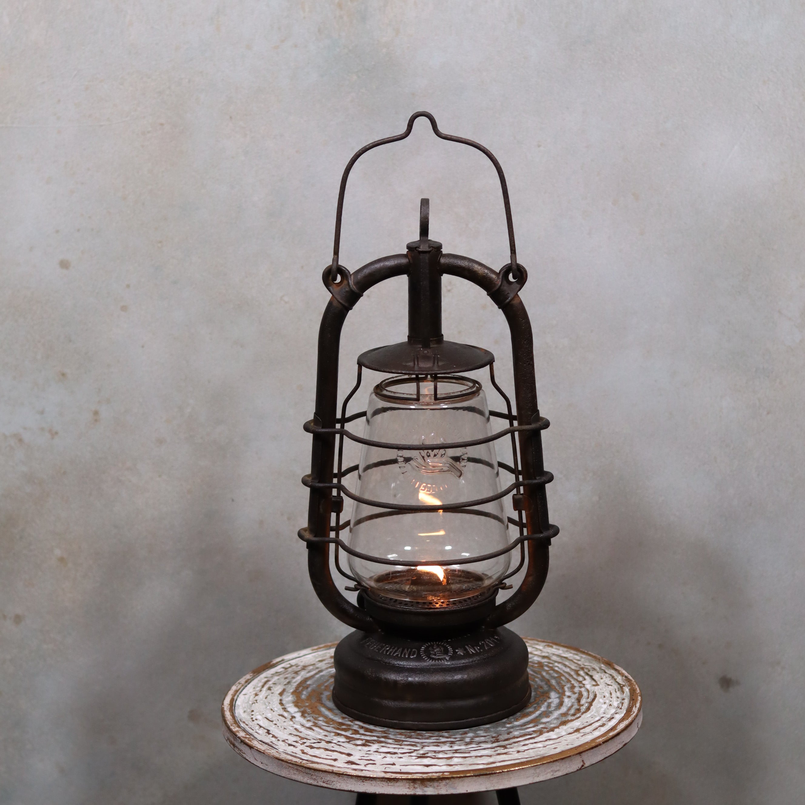 Vintage Feuerhand 201 Storm Lantern – Rare Glass – 1920s/1930s – Original Parts oil lamp glowing inside rusty metal frame