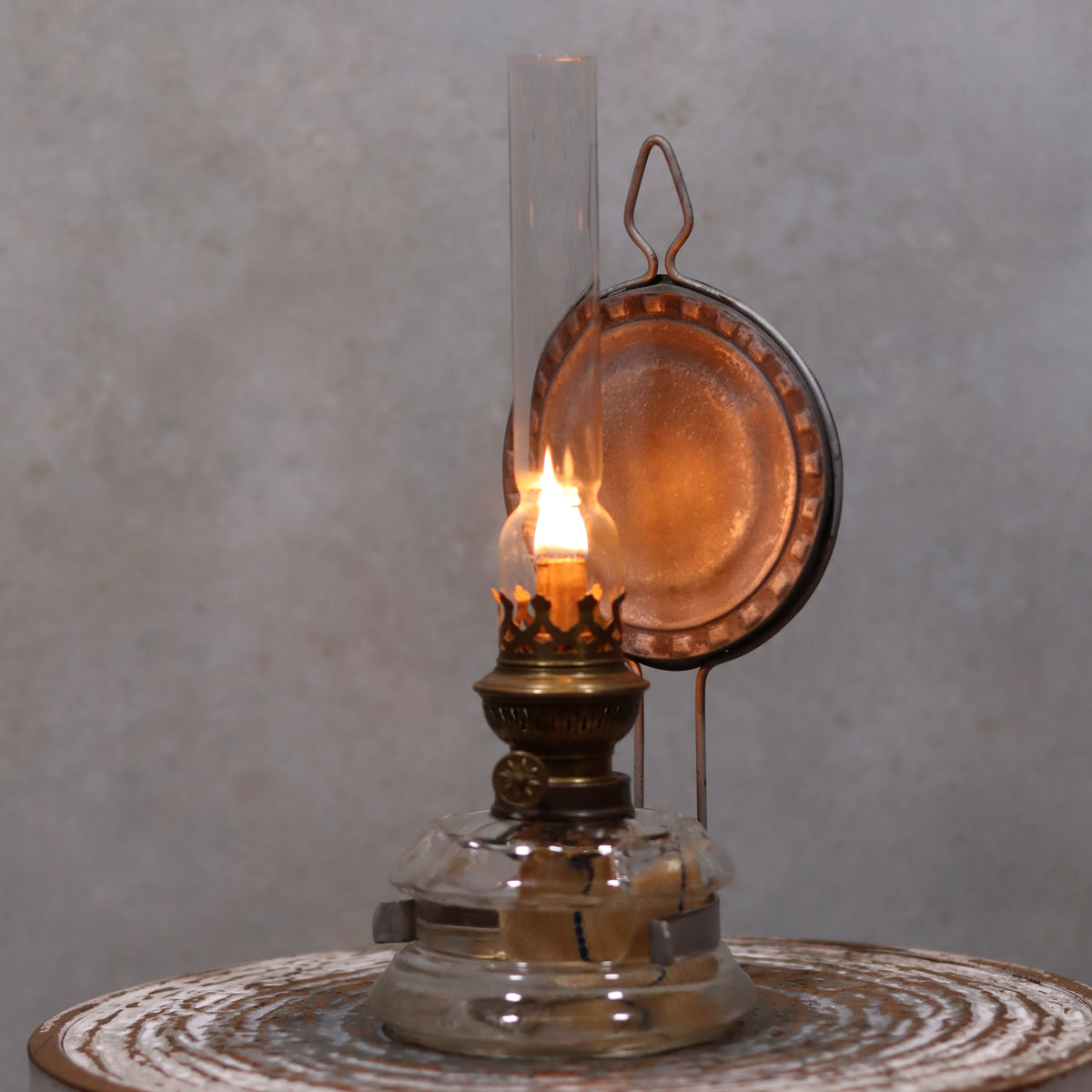 Vintage Oil Lamp – Classic Wall or Kitchen Lamp with Silver Reflector lit, showcasing elegant antique design and reflective silver backing.
