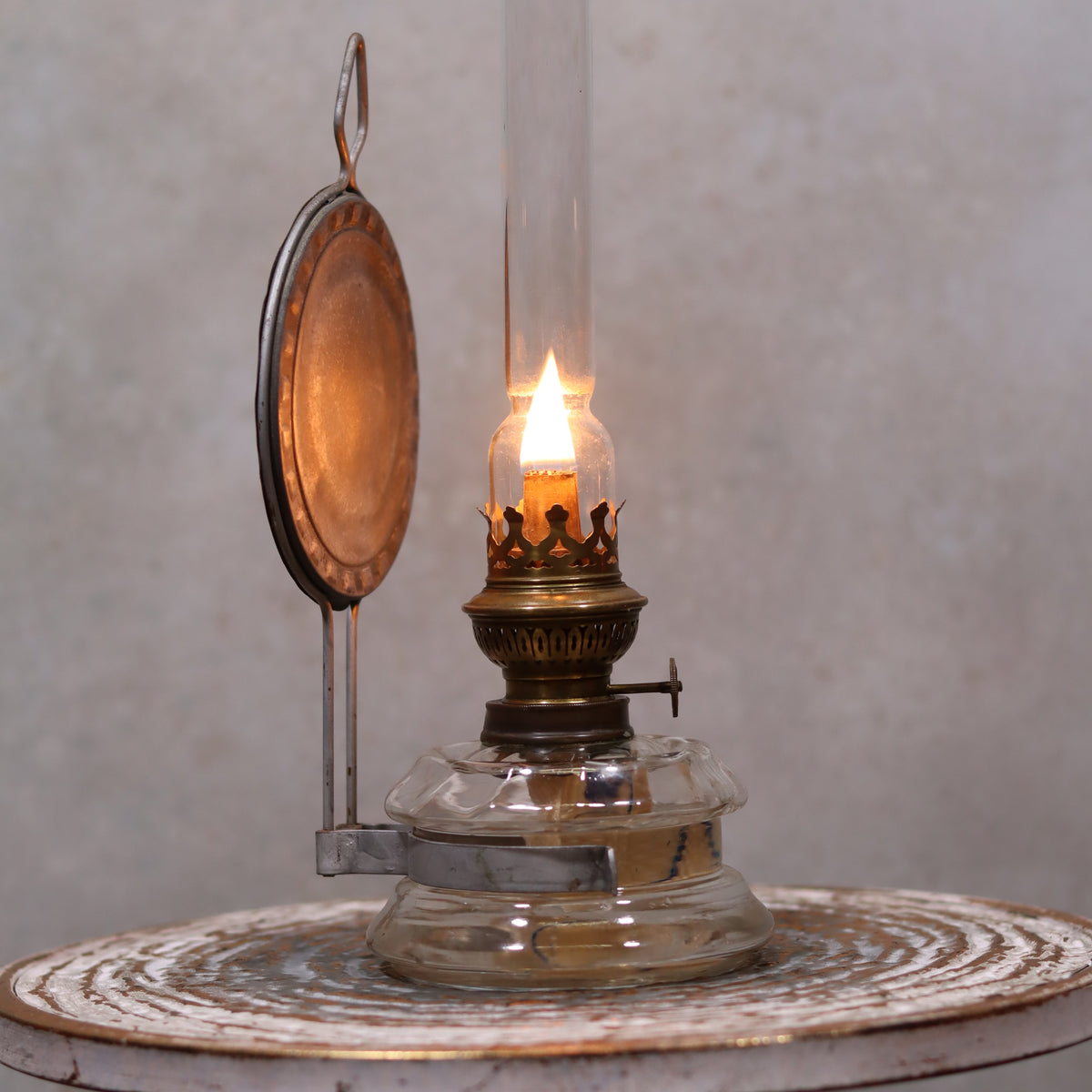 Vintage Oil Lamp – Classic Wall or Kitchen Lamp with Silver Reflector lit, showcasing its elegant vintage design and warm glow.