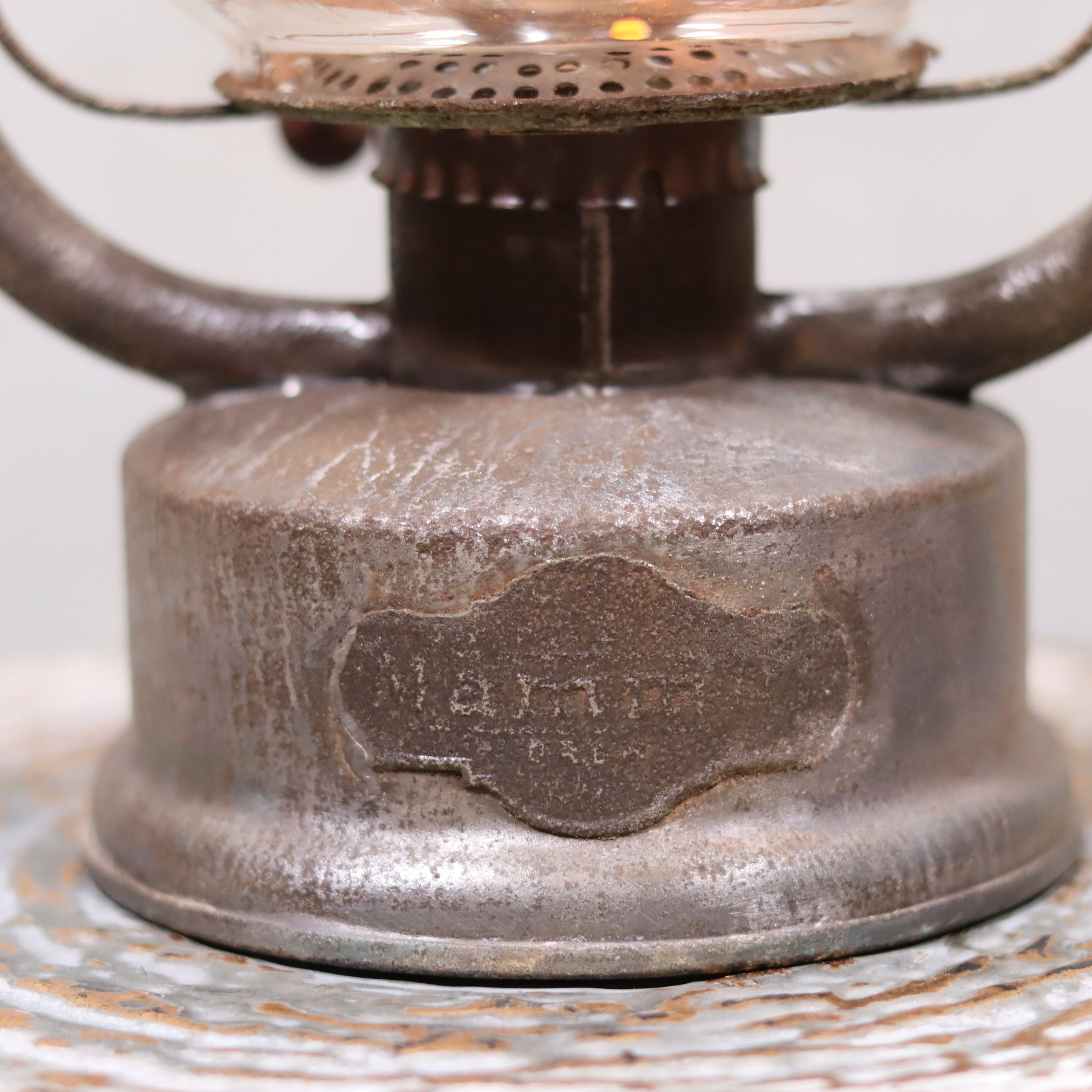 Close-up of the oil lamp base on the Rare German Hurricane Lantern – Mammut by Lohmann & Ruhland (Circa 1910)