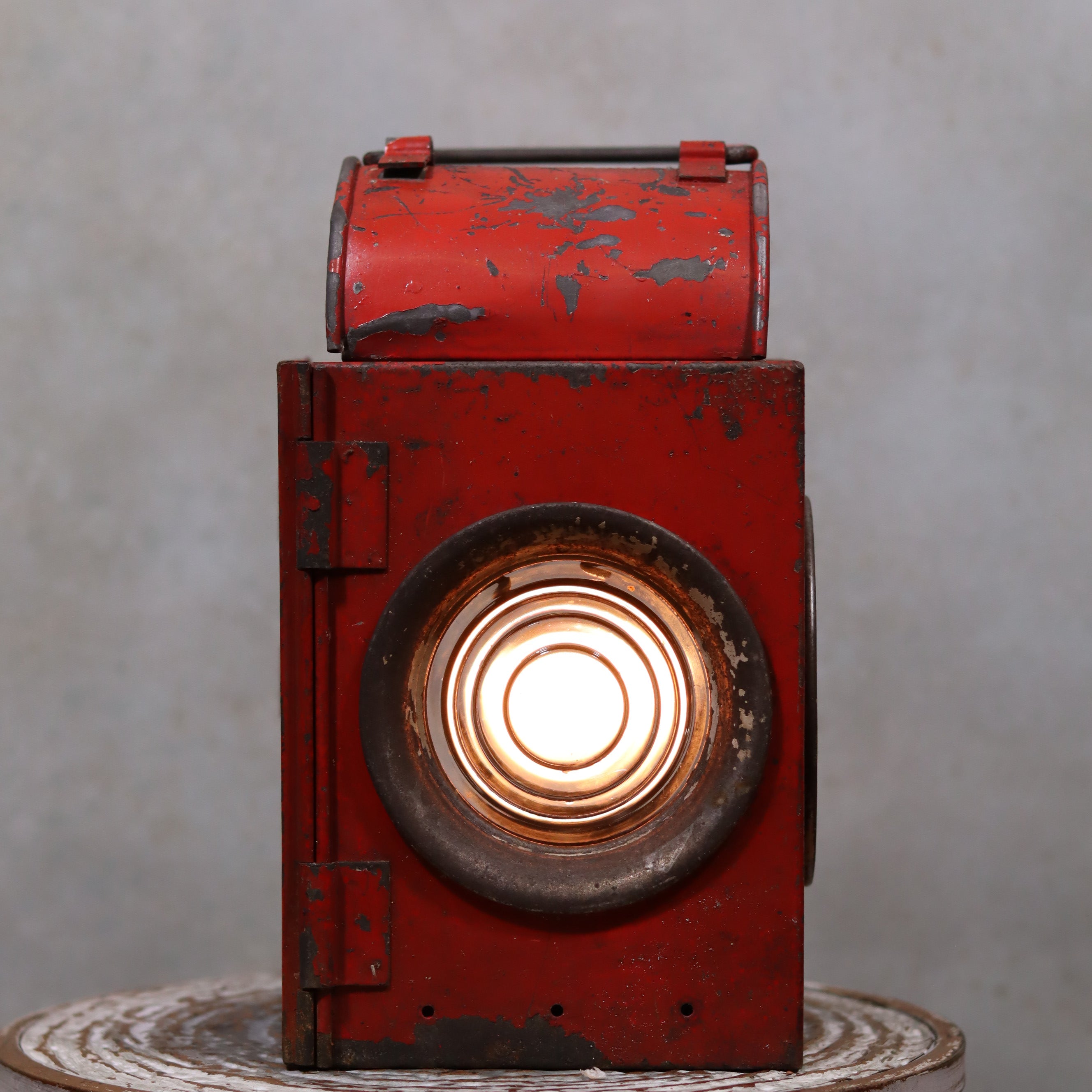 Vintage Roadwork Oil Lamp – A. Sartorius Wuppertal with Fishtail Burner (1960s) in red metal with lit circular glass lens