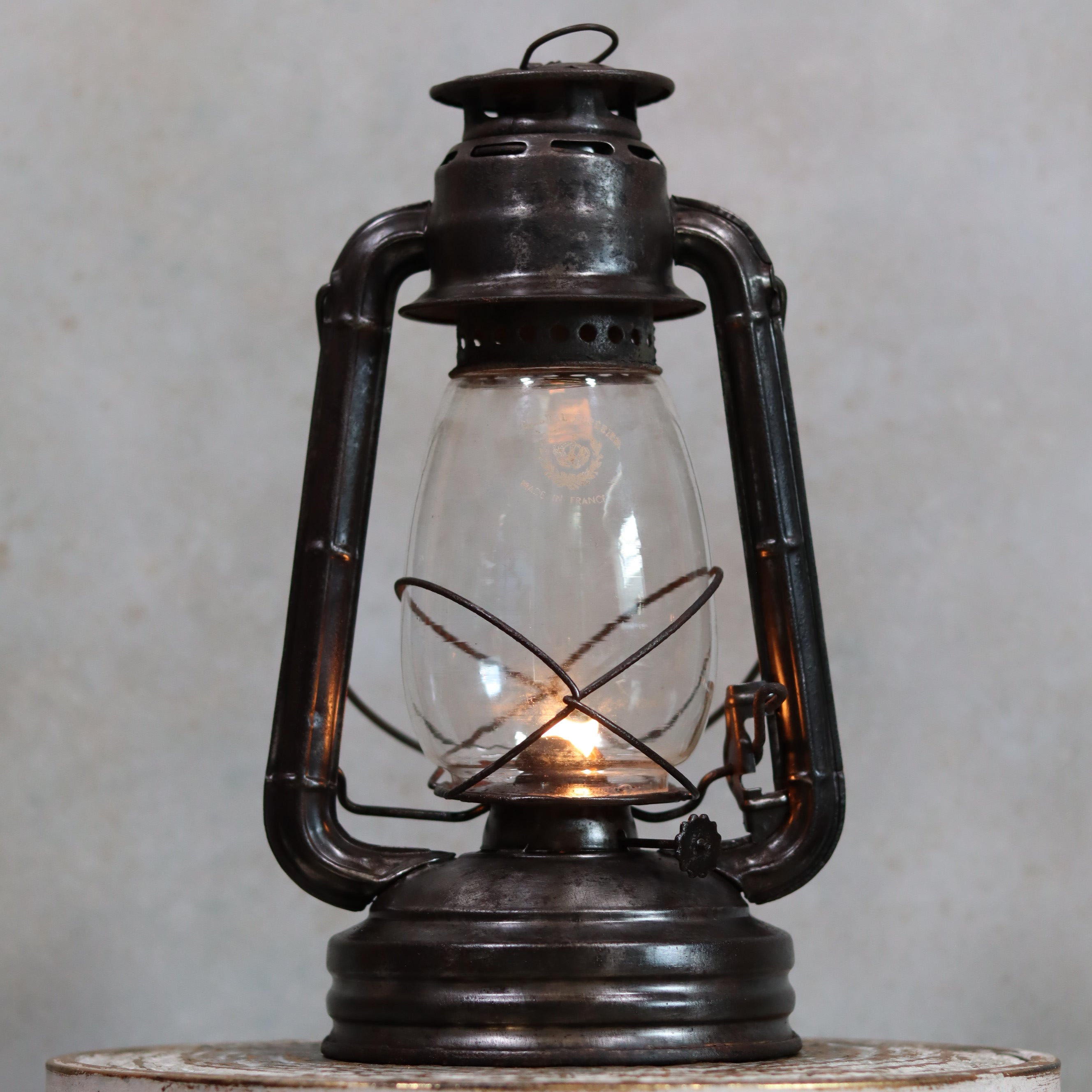 Vintage French ALG No. 6 Hurricane Lantern – Cristal Supérieur Glass (1930s) oil lamp with metal frame and lit flame