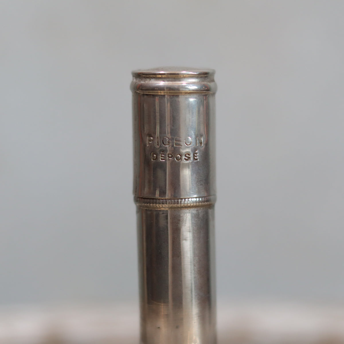 Rare Antique Pigeon Pocket Oil Lamp – Model 60, Complete and Functional, Circa 1918–1930, close-up of metal detail on lamp top
