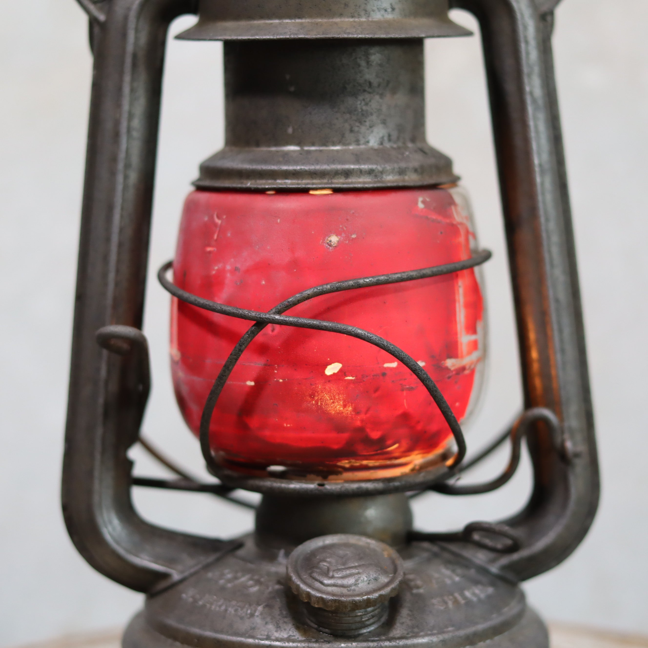 Vintage Feuerhand Hurricane Lantern – Model 276 (1950s) with rare glass oil lamp showing red glass and metal frame details