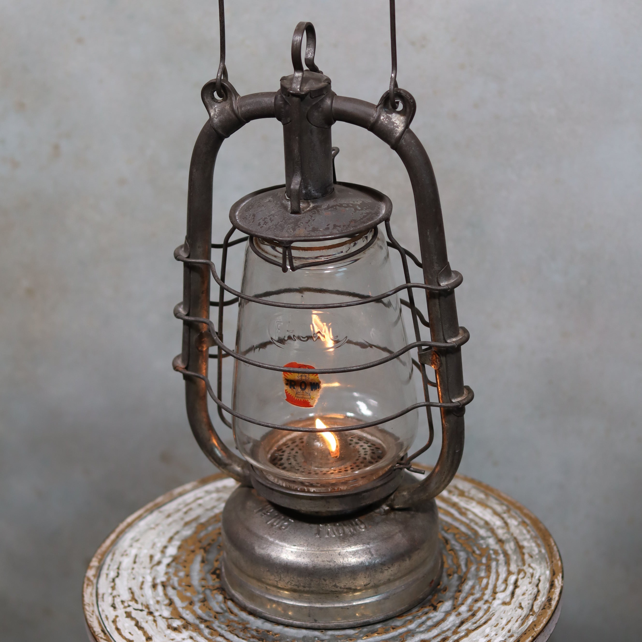 Vintage Frowo 105 Hurricane Lantern – Original Glass & Partial Sticker oil lamp with metal frame and glowing flame inside