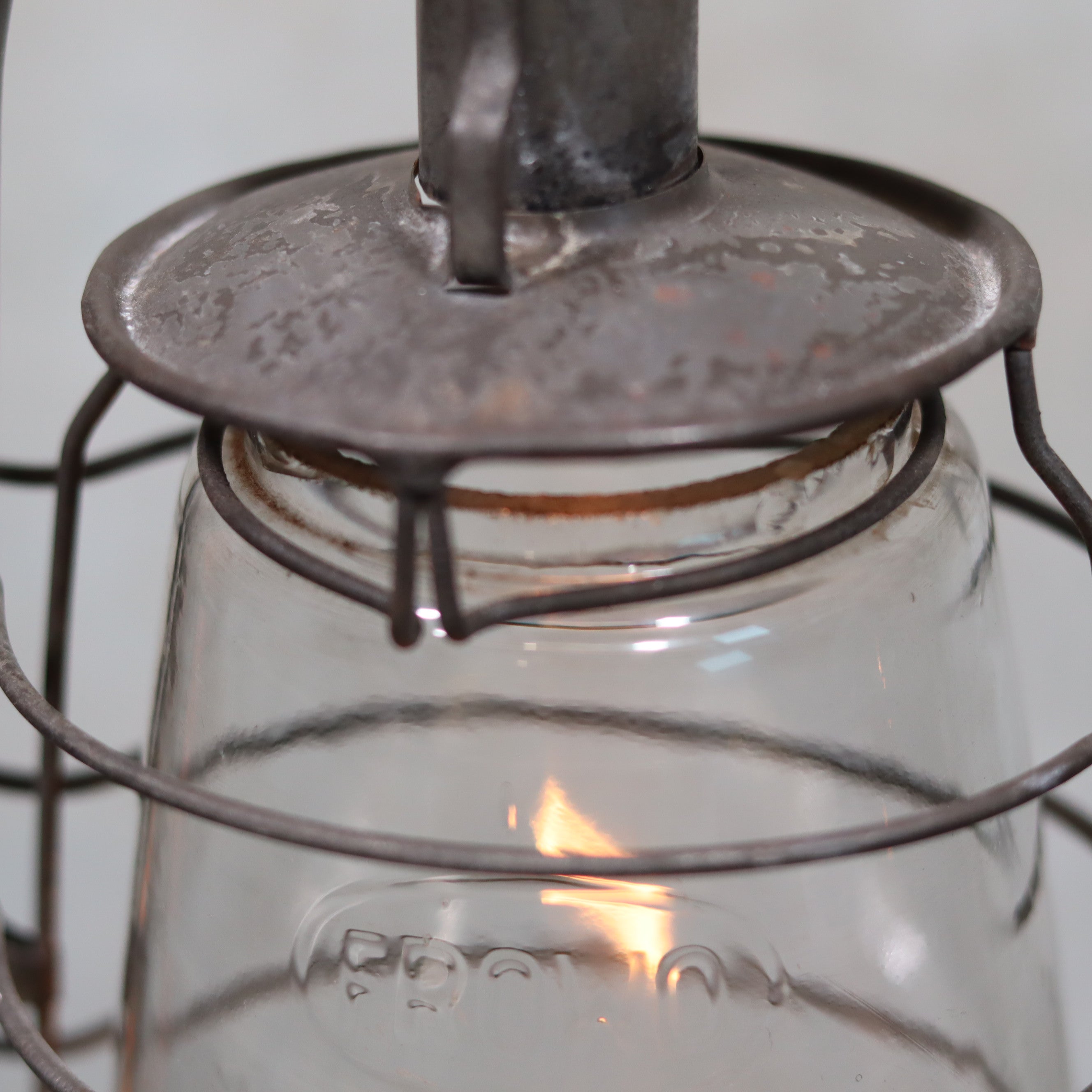 Vintage Frowo 105 Hurricane Lantern – Original Glass & Partial Sticker oil lamp with rustic metal frame and glowing flame detail