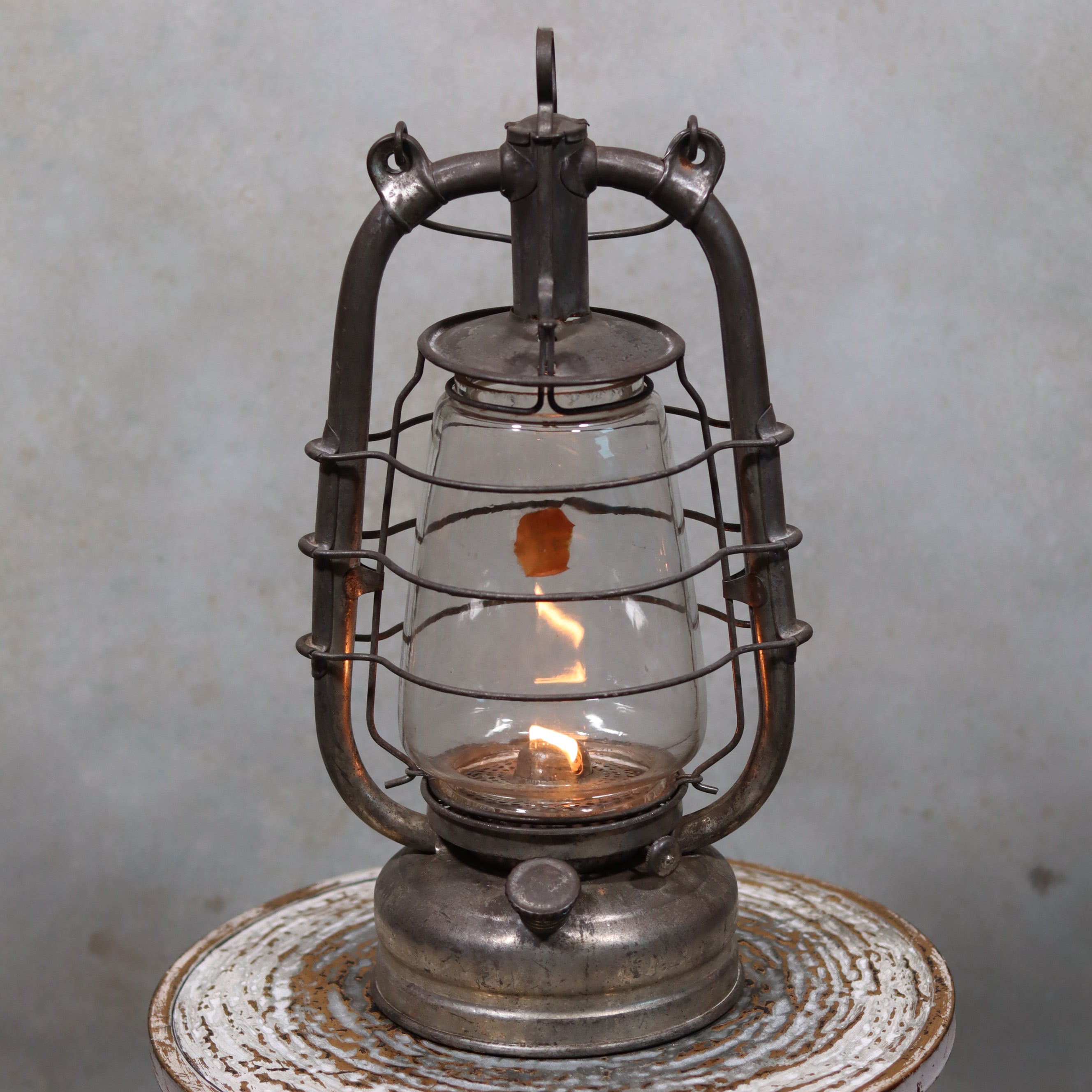 Vintage Frowo 105 Hurricane Lantern – Original Glass & Partial Sticker with lit oil lamp and metal frame design