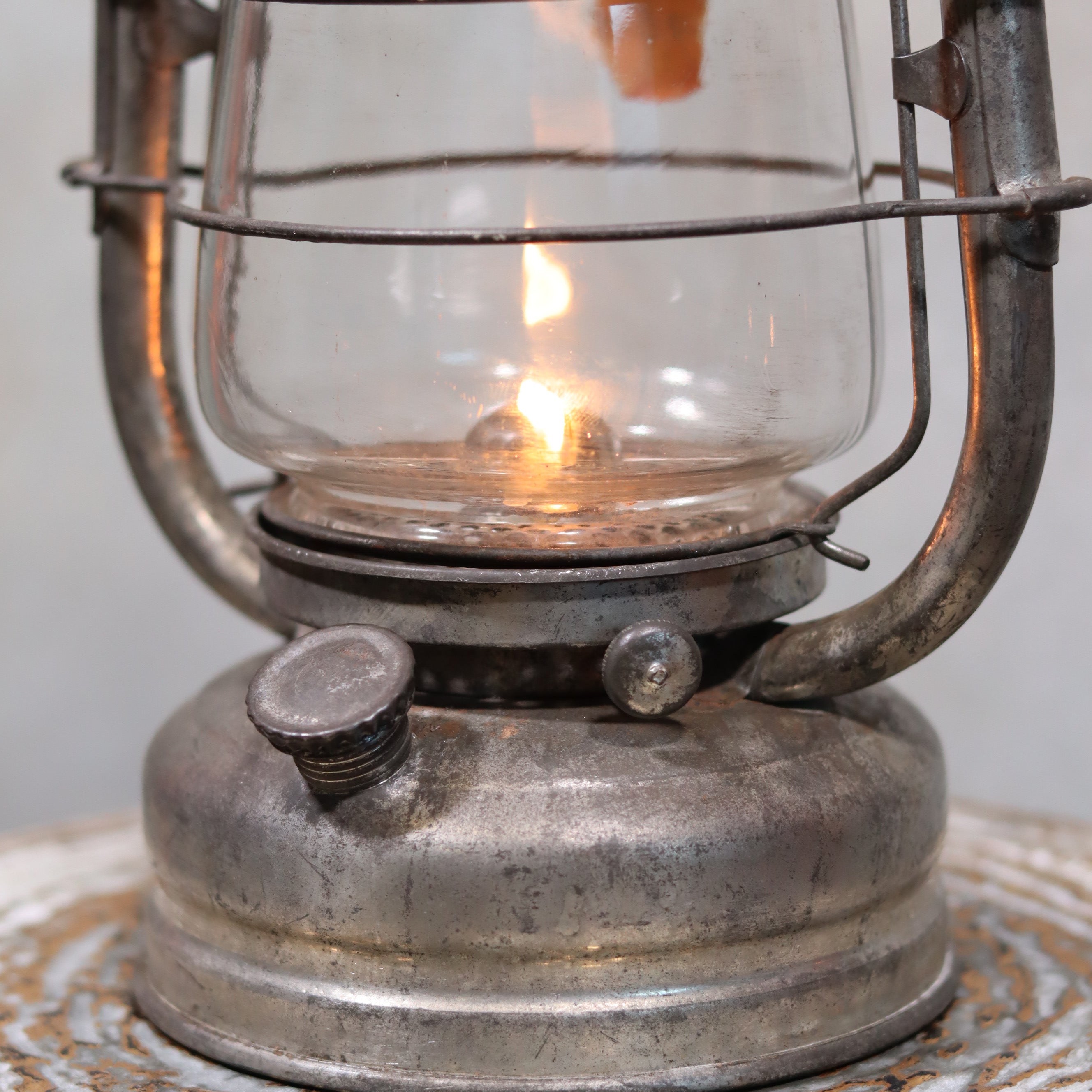 Vintage Frowo 105 Hurricane Lantern – Original Glass & Partial Sticker German oil lamp with lit flame and rustic metal body