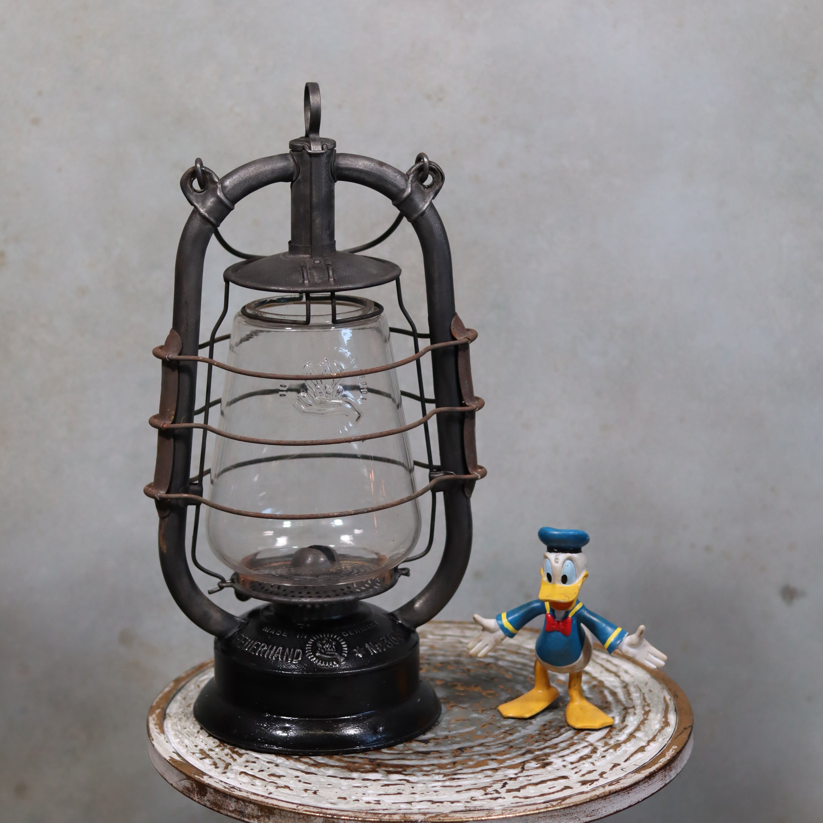 Rare Feuerhand 305 Hurricane Lantern – German Vintage Model with Black Tank (1930–1941) oil lamp displayed on wooden surface