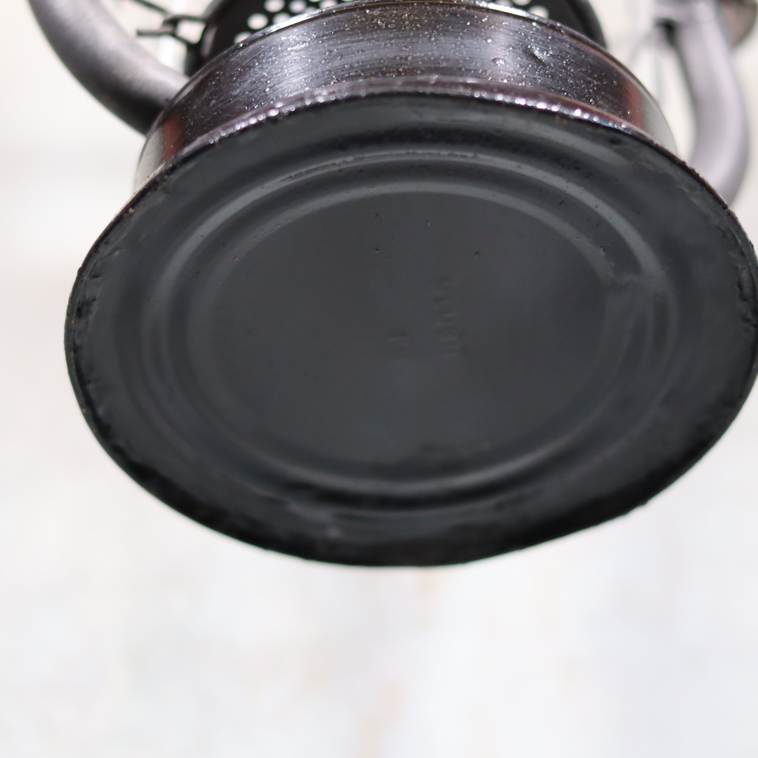 Bottom view of Rare Feuerhand 305 Hurricane Lantern – German Vintage Model with Black Tank (1930–1941) showing metal base detail