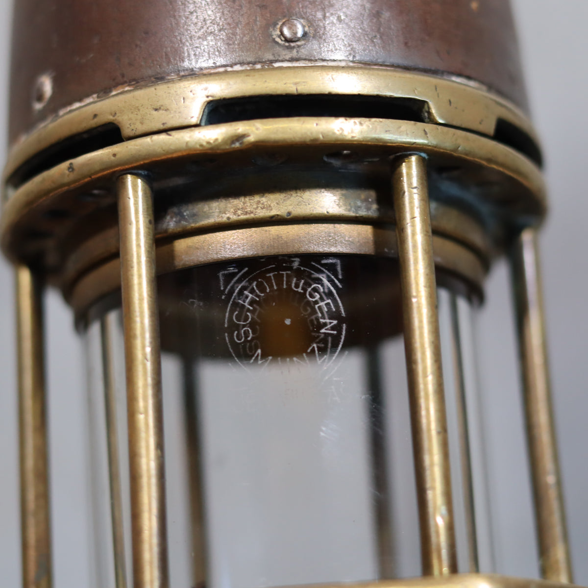 Close-up of Heavy Vintage Mining Lamp – Numbered 77 – Jenaer Glass – 1930s–1950s showcasing branded glass and metal details
