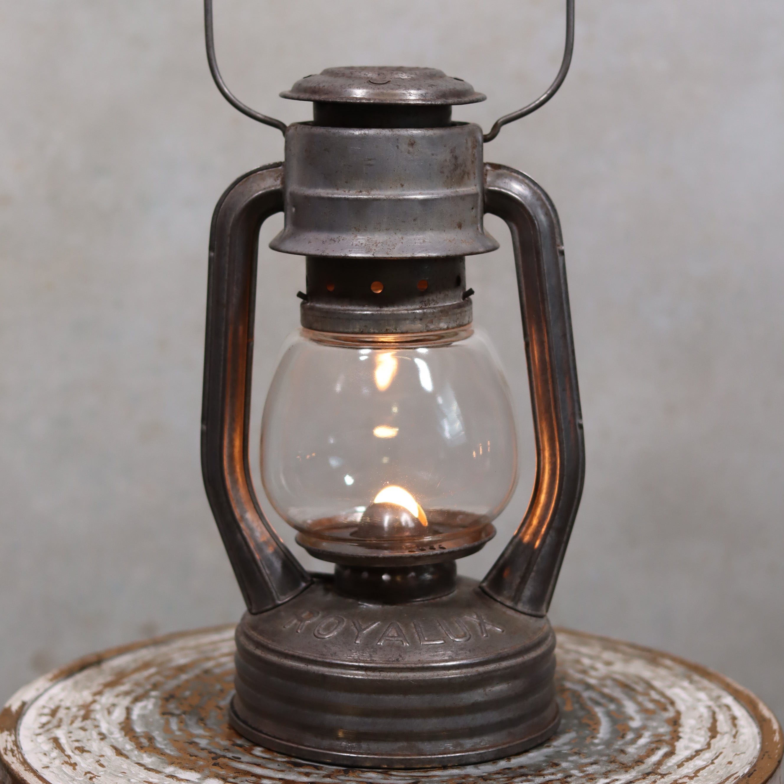 Vintage French Royalux Hurricane Lantern – Glass Lift Mechanism (27 cm) with lit oil lamp and rustic metal finish