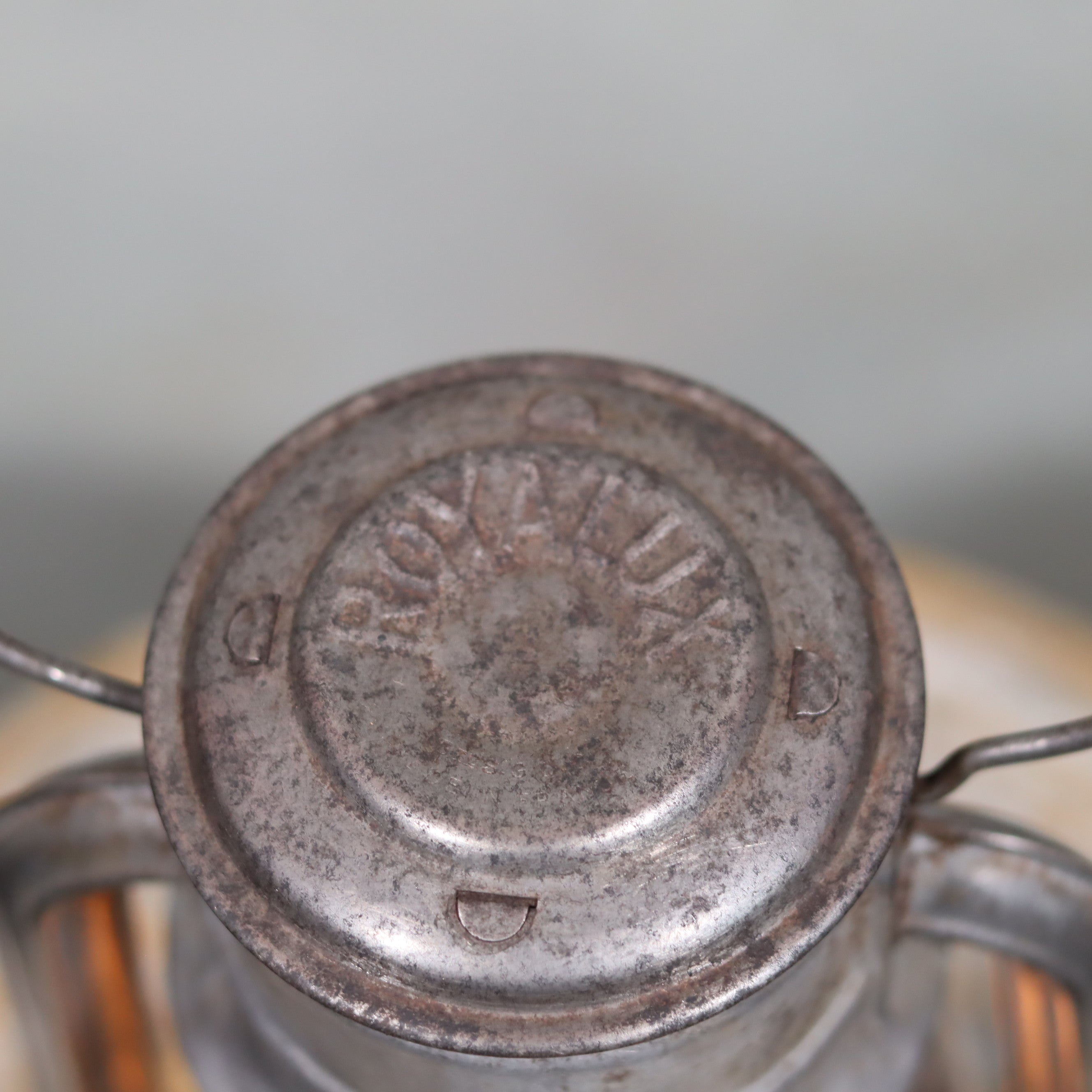 Close-up of the top metal part of the Vintage French Royalux Hurricane Lantern – Glass Lift Mechanism (27 cm) oil lamp