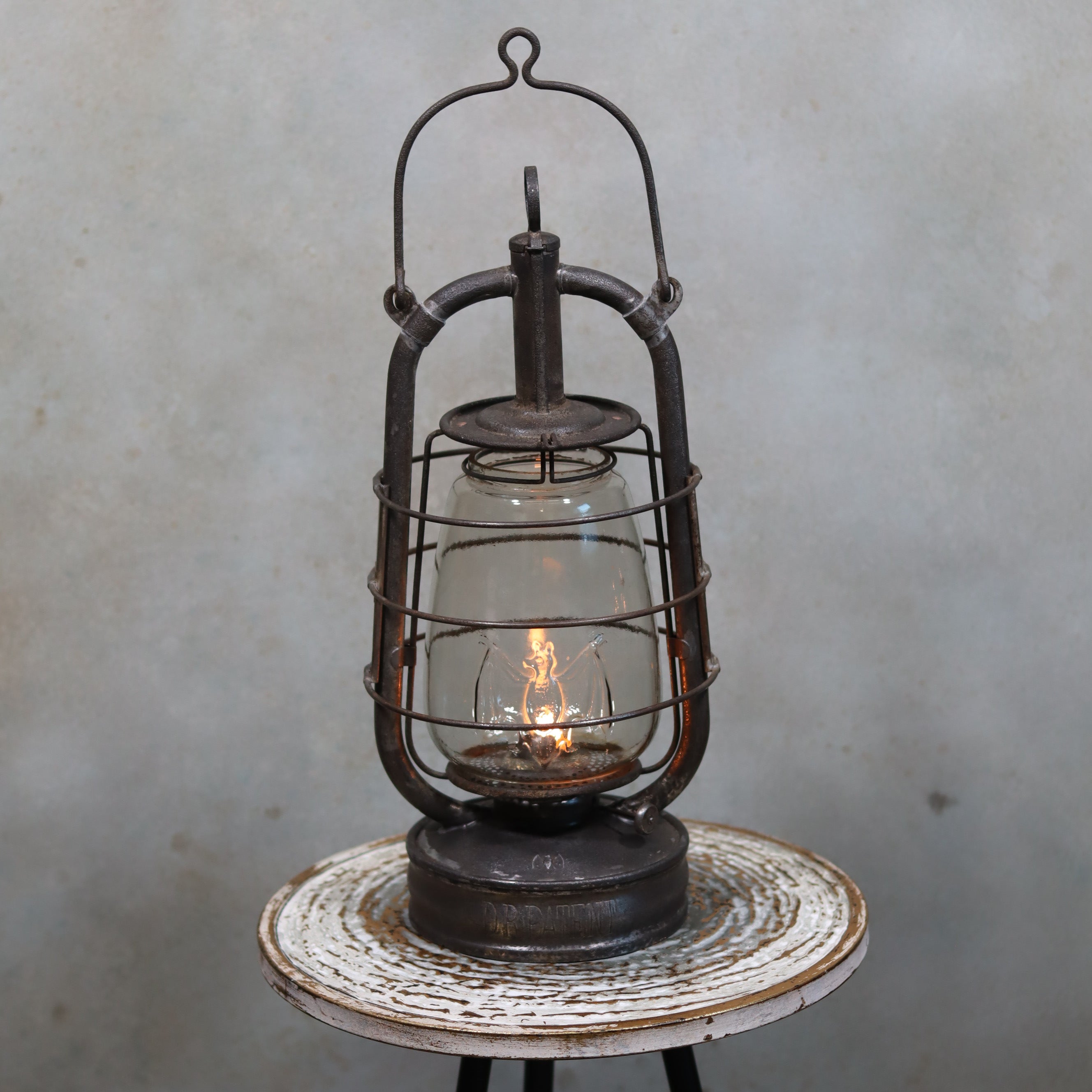 Rare Antique Hurricane Lantern – Stübgen & Co, DR Patent 2833 (Circa 1907–1909) with lit oil lamp and rustic metal frame