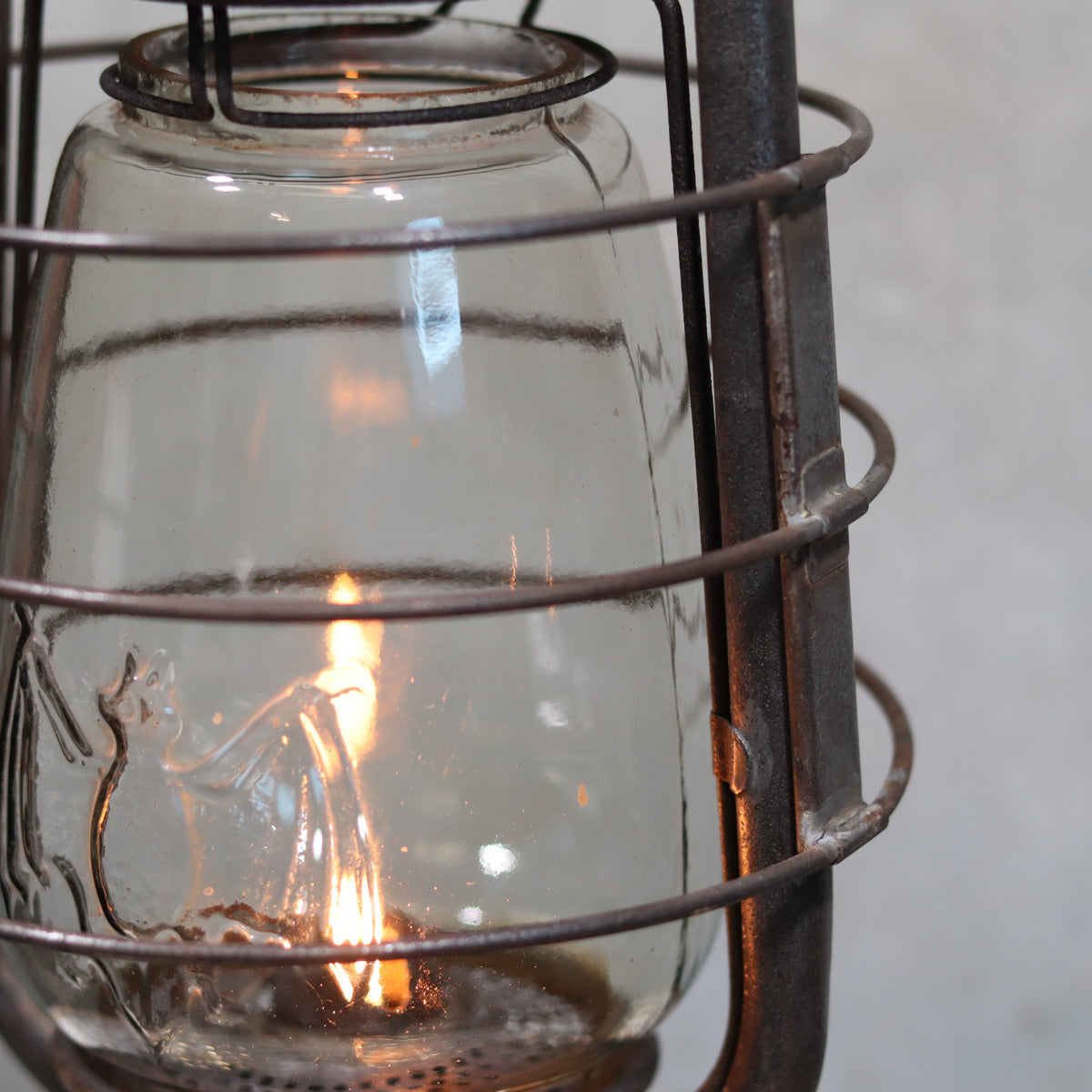 Rare Antique Hurricane Lantern – Stübgen & Co, DR Patent 2833 (Circa 1907–1909) with glowing oil lamp flame inside protective glass.