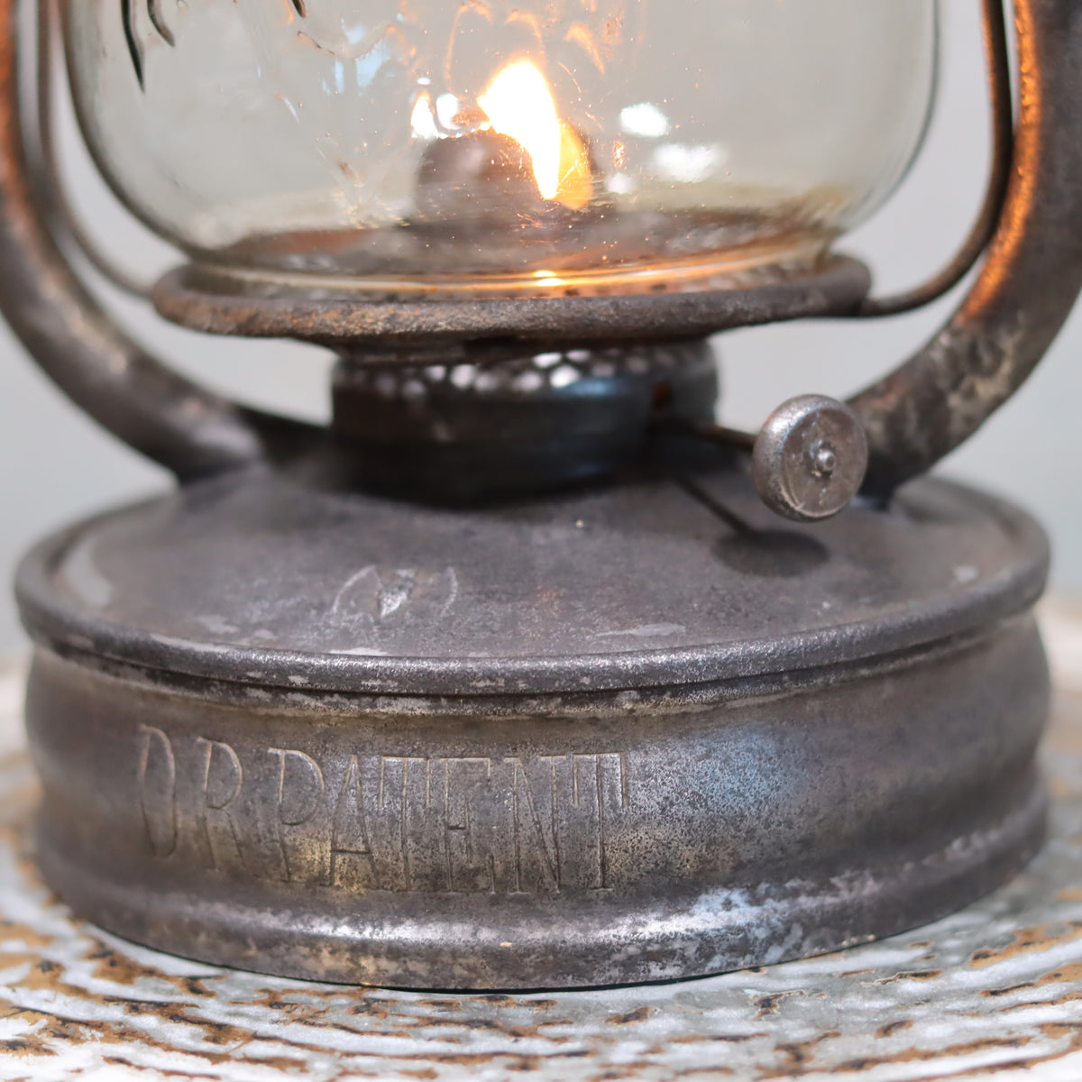 Rare Antique Hurricane Lantern – Stübgen & Co, DR Patent 2833 (Circa 1907–1909) oil lamp close-up showing lit wick and metal base.