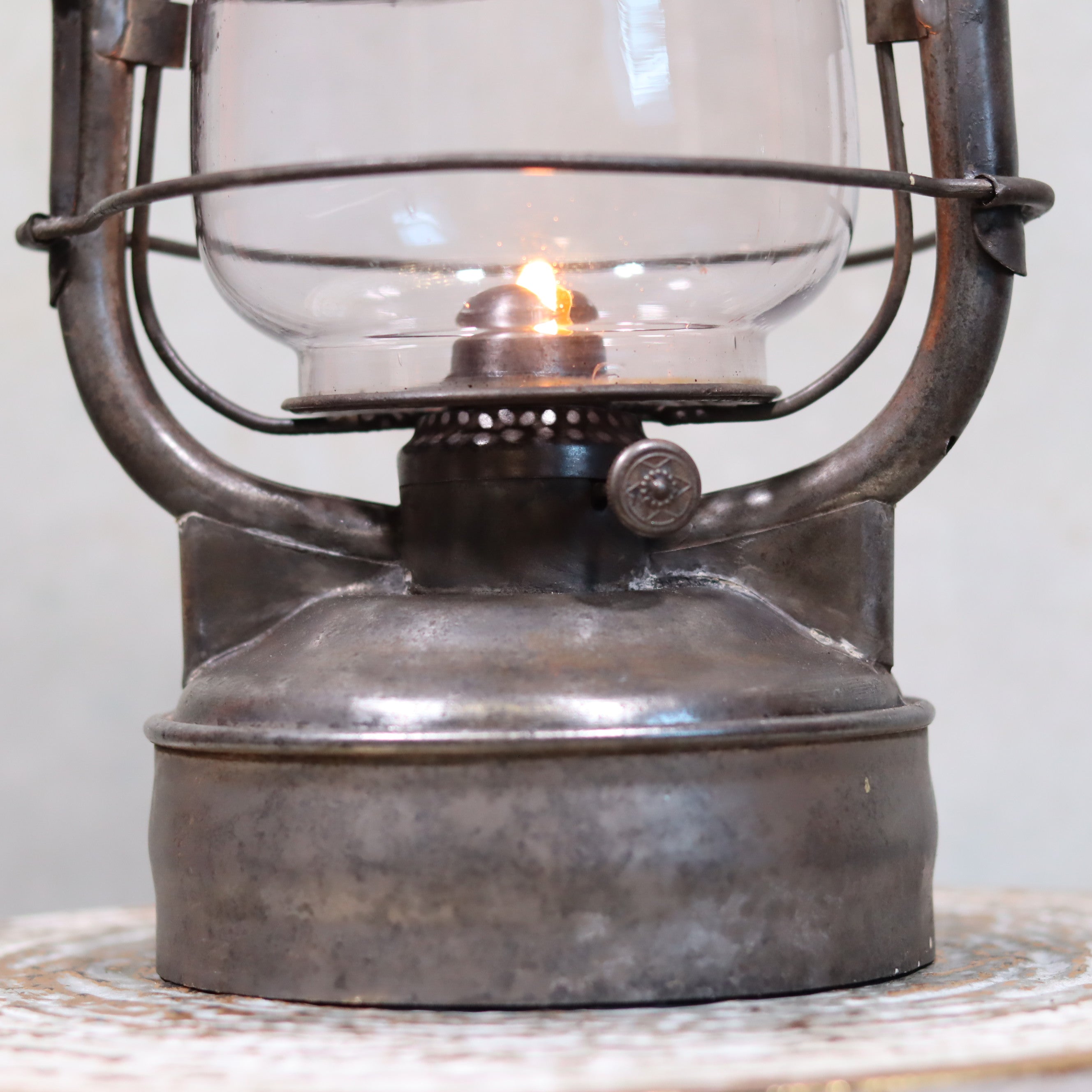 Close-up of burning Rare French Hurricane Lantern – “La Lumineuse” by SIF (1920s–1930s) showcasing its vintage oil lamp design