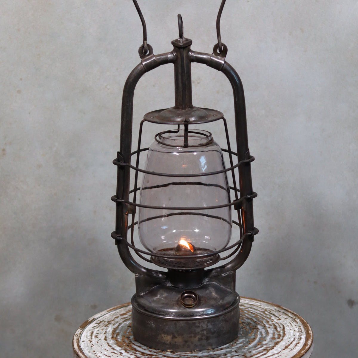 Rare French Hurricane Lantern – “La Lumineuse” by SIF (1920s–1930s) oil lamp with protective metal frame and glowing flame