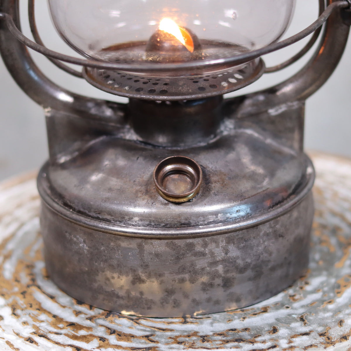 Close-up of lit oil lamp on Rare French Hurricane Lantern – “La Lumineuse” by SIF (1920s–1930s) showcasing vintage metalwork.
