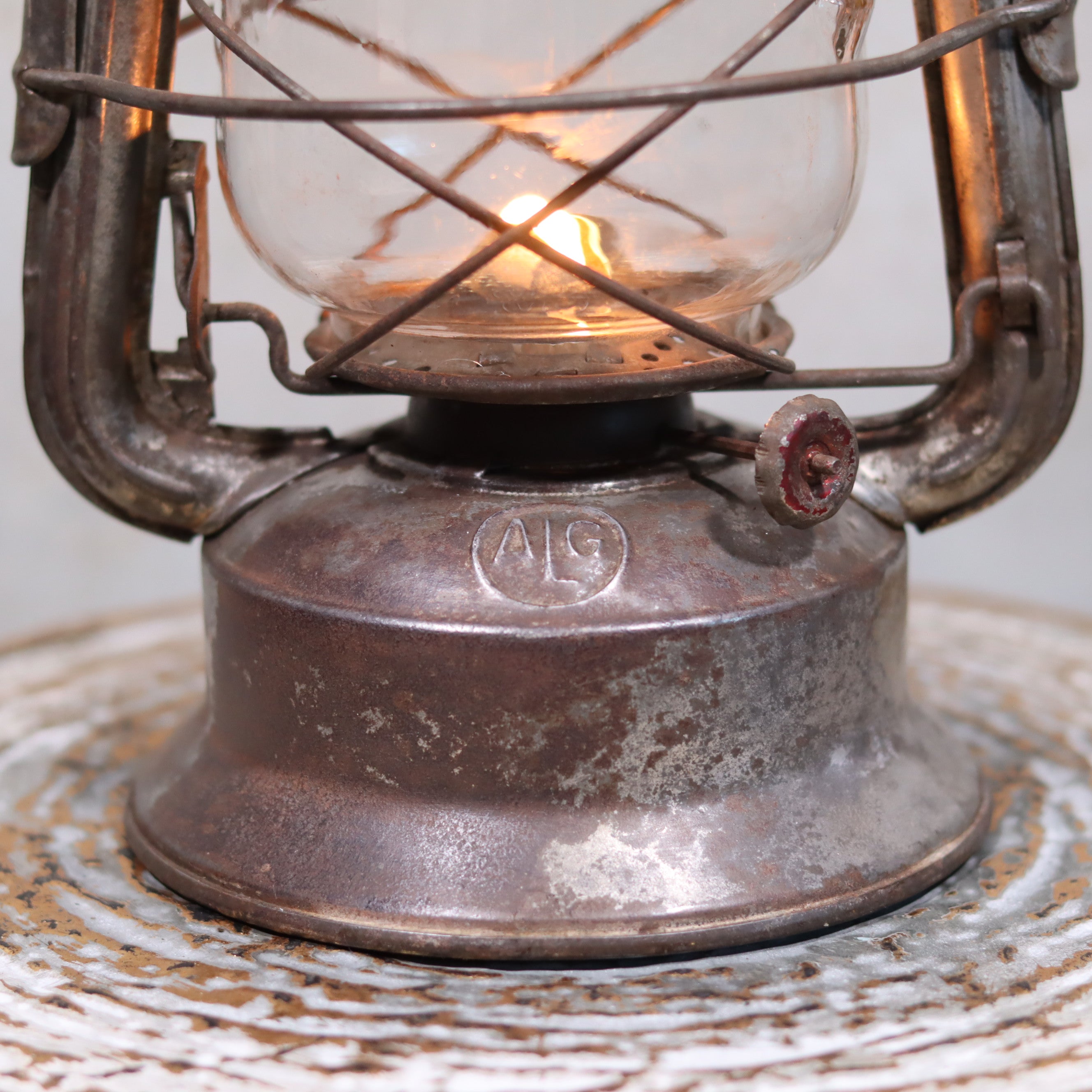 Vintage French ALG Guillouard Hurricane Lantern – Luciole Model (1960s–1980s) showing detailed oil lamp base and flame