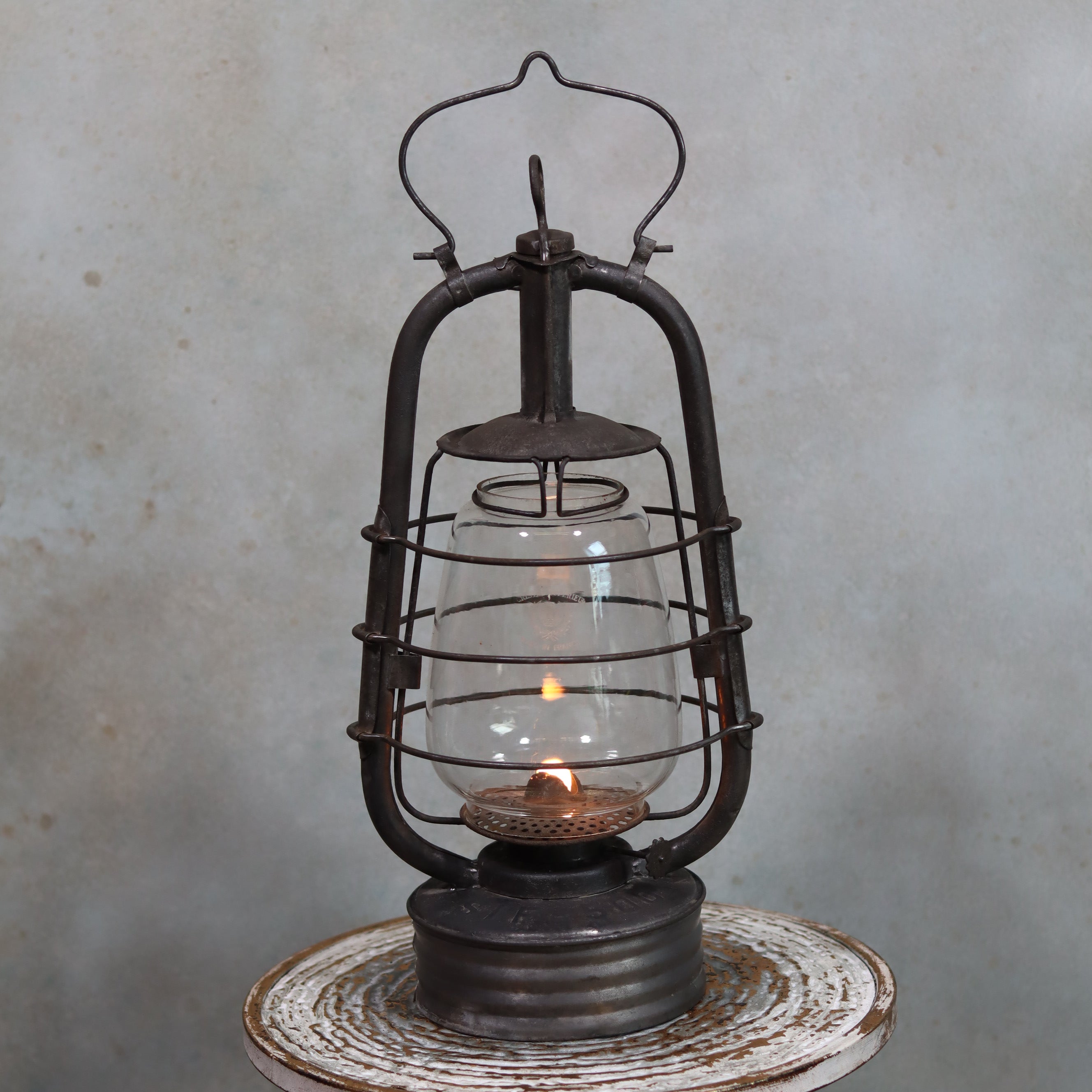 Vintage French Hurricane Lantern – SIF 500 – Cristal Supérieur Glass oil lamp with lit flame and rustic metal frame from 1950s–1970s
