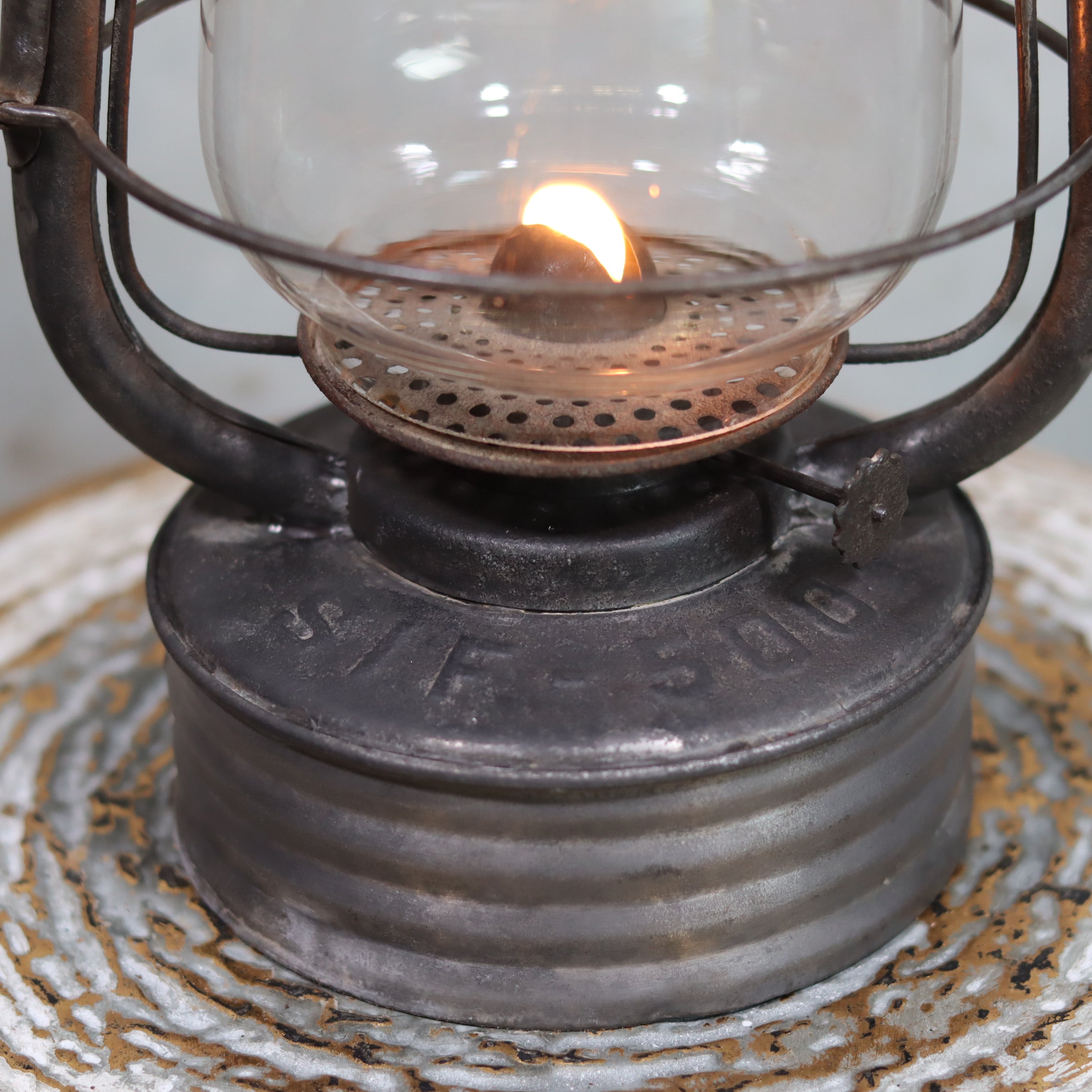 Close-up of the lit Vintage French Hurricane Lantern – SIF 500 – Cristal Supérieur Glass – 1950s–1970s oil lamp base and flame