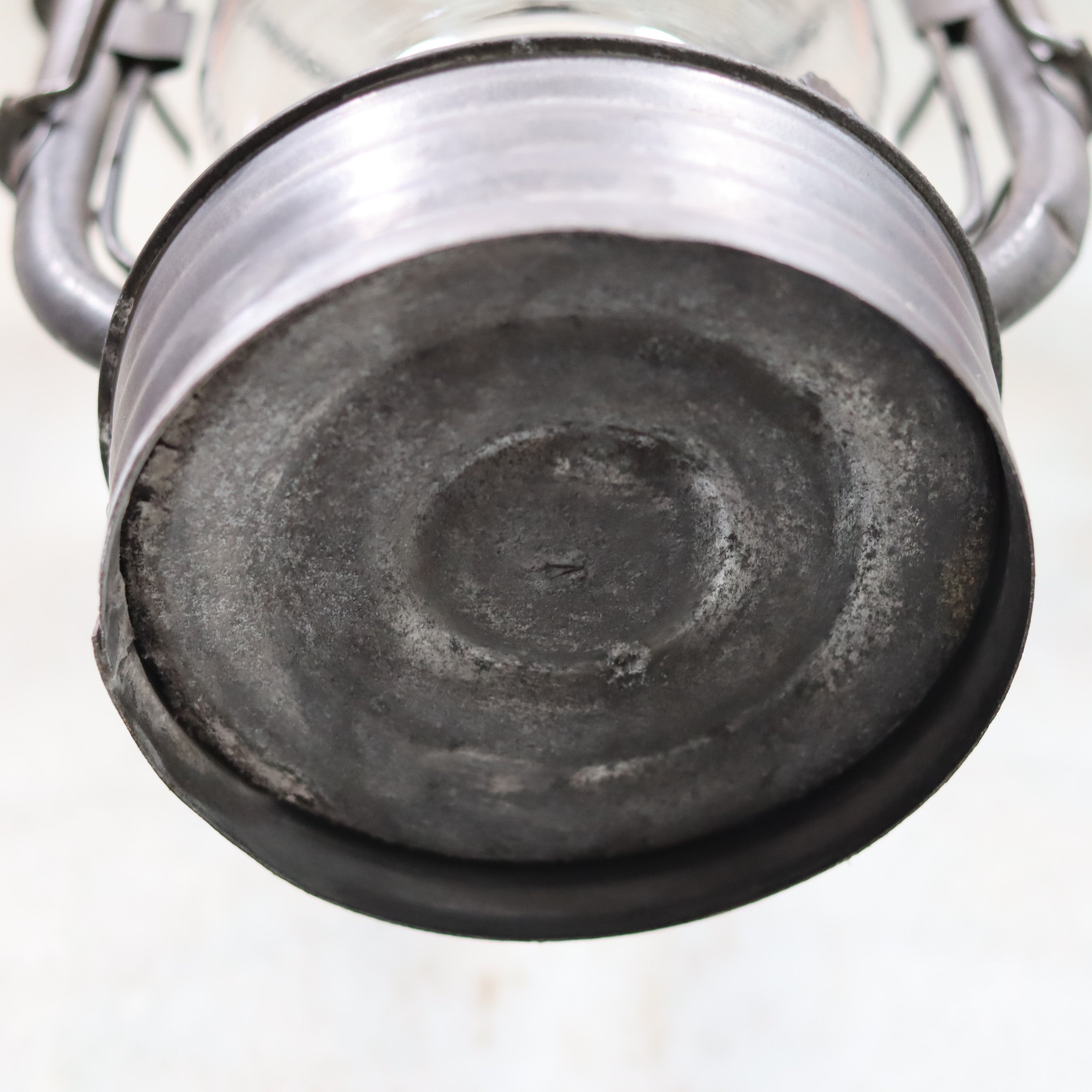 Base of the Vintage French Hurricane Lantern – SIF 500 – Cristal Supérieur Glass – 1950s–1970s oil lamp showing aged metal details
