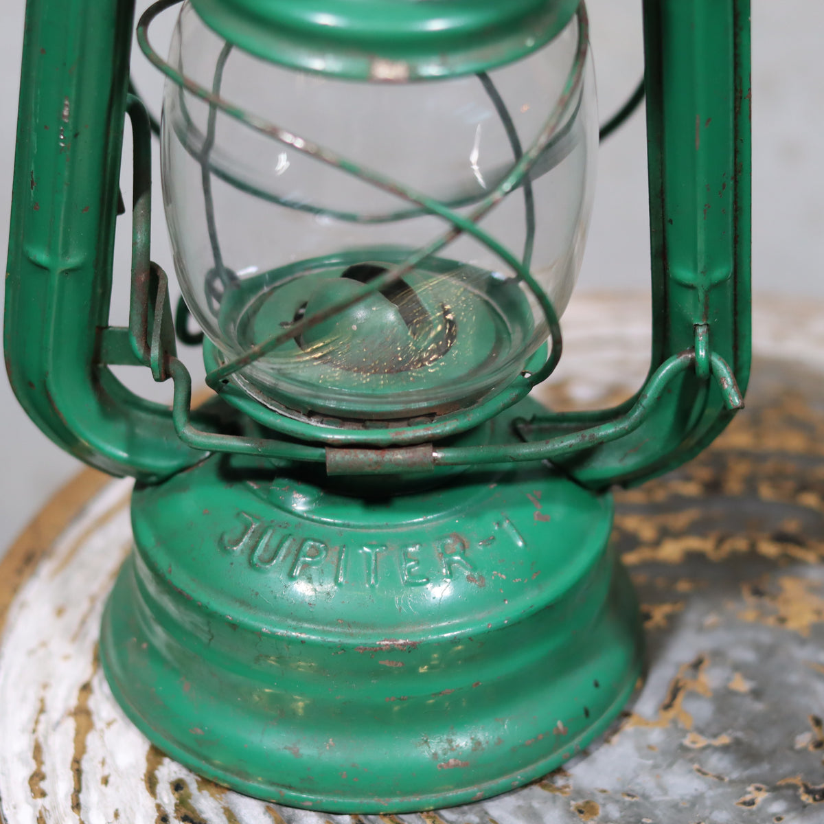 Rare Vintage Jupiter-1 Green Hurricane Lantern – With Unique Glass Holder & Original Sticker showing close-up of oil lamp base and glass holder