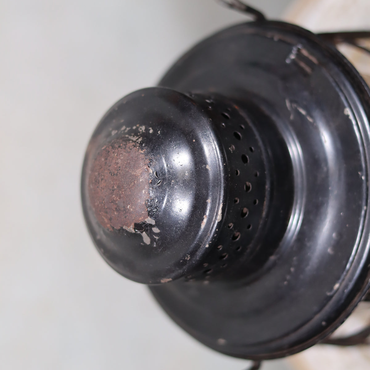 Vintage Keystone Ware Hurricane Lantern – Black Finish with Dietz Glass showing close-up of rusted metal top of oil lamp