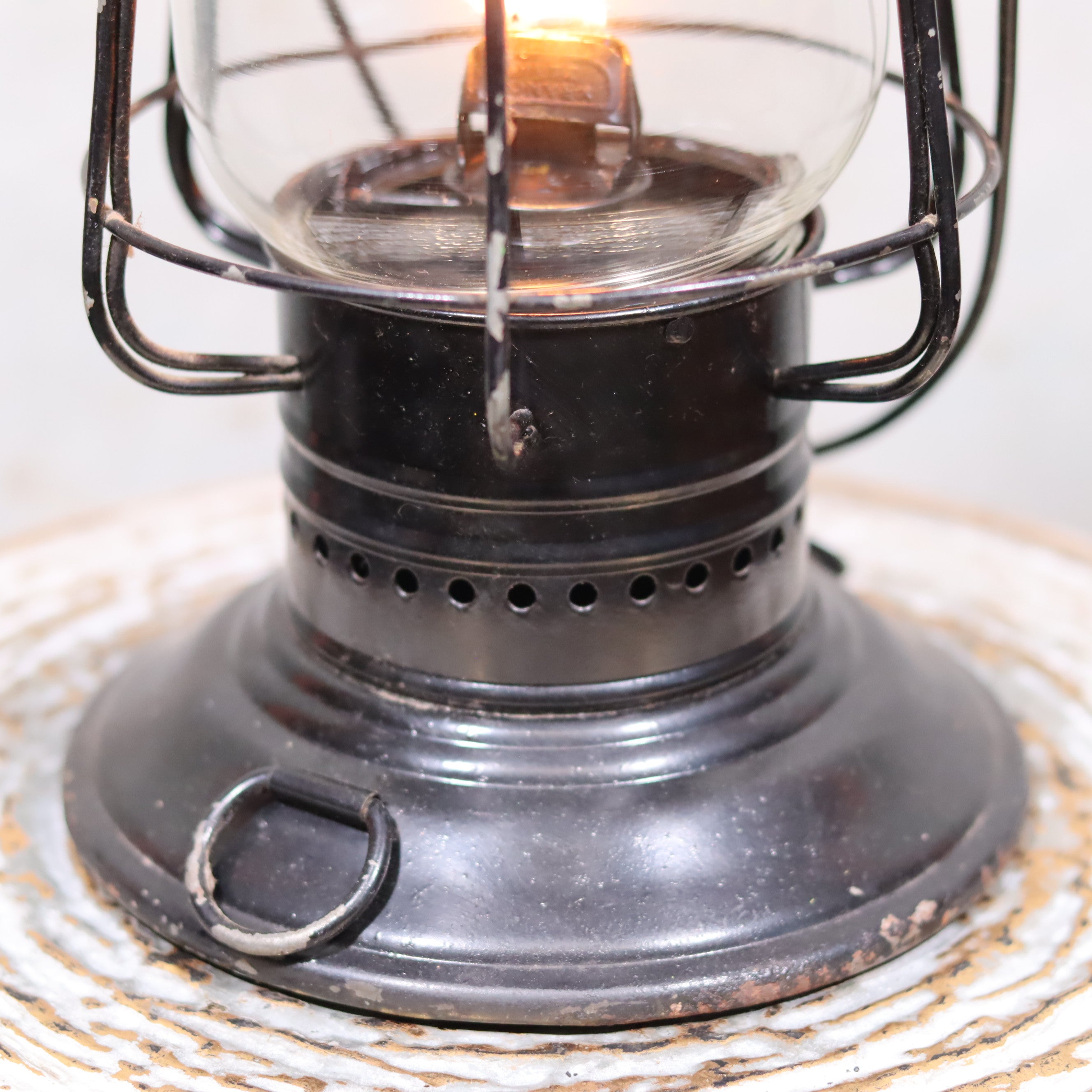 Vintage Keystone Ware Hurricane Lantern – Black Finish with Dietz Glass oil lamp close-up showing flame and metal base