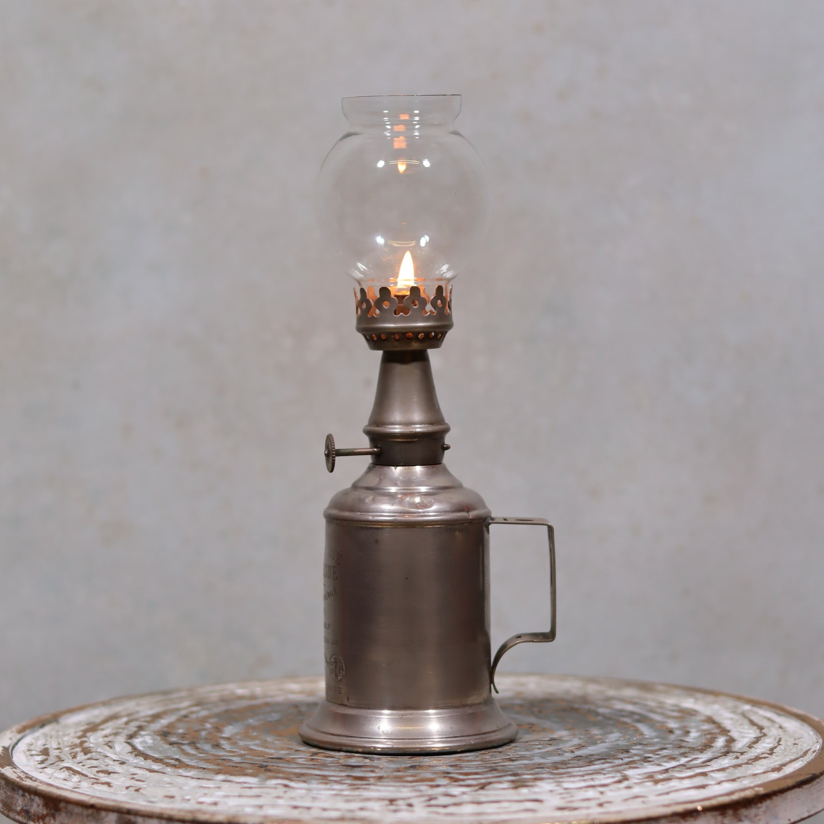Vintage SIAE Oil Lamp – “La Parisienne” Model, Complete & Functional with lit flame and metal body on rustic surface