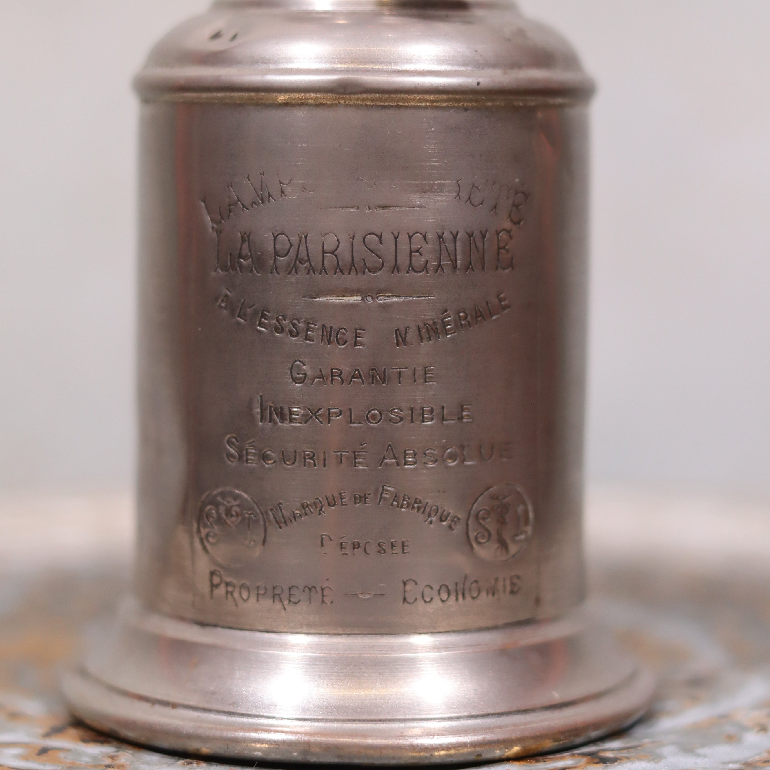 Close-up of metal engraving on Vintage SIAE Oil Lamp – “La Parisienne” Model, Complete & Functional showing detailed branding and text.