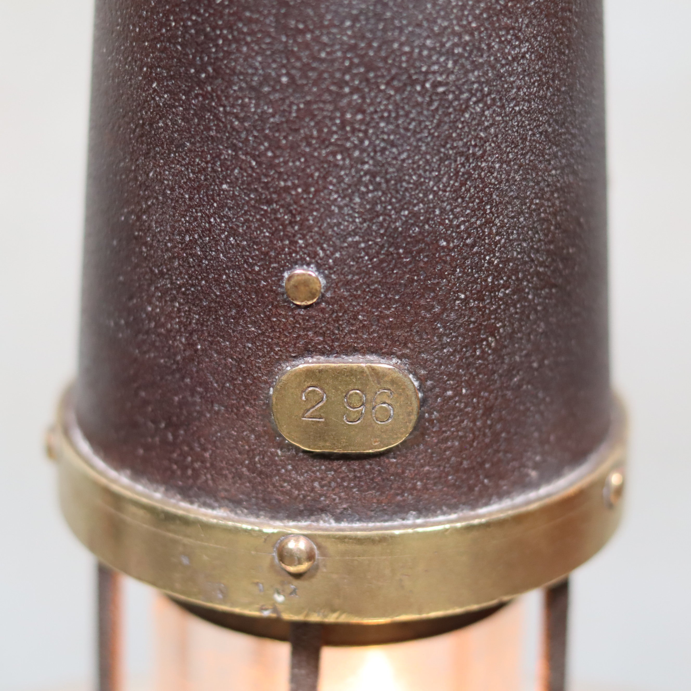 Close-up of metal details on the Antique British Mining Lamp – Davies Derby Safety Lamp (Circa 1900) oil lamp.