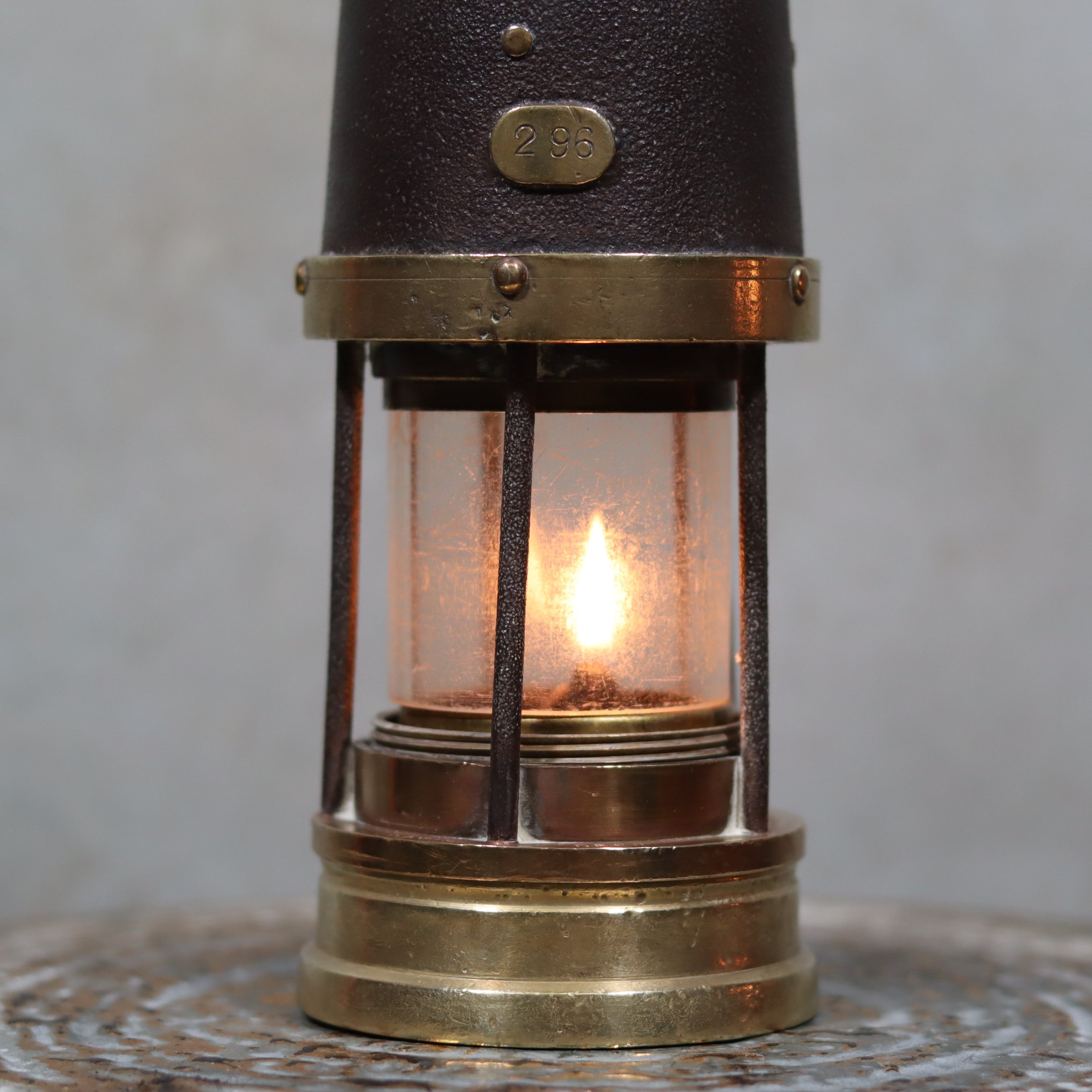 Antique British Mining Lamp – Davies Derby Safety Lamp (Circa 1900) glowing oil lamp with brass and metal details