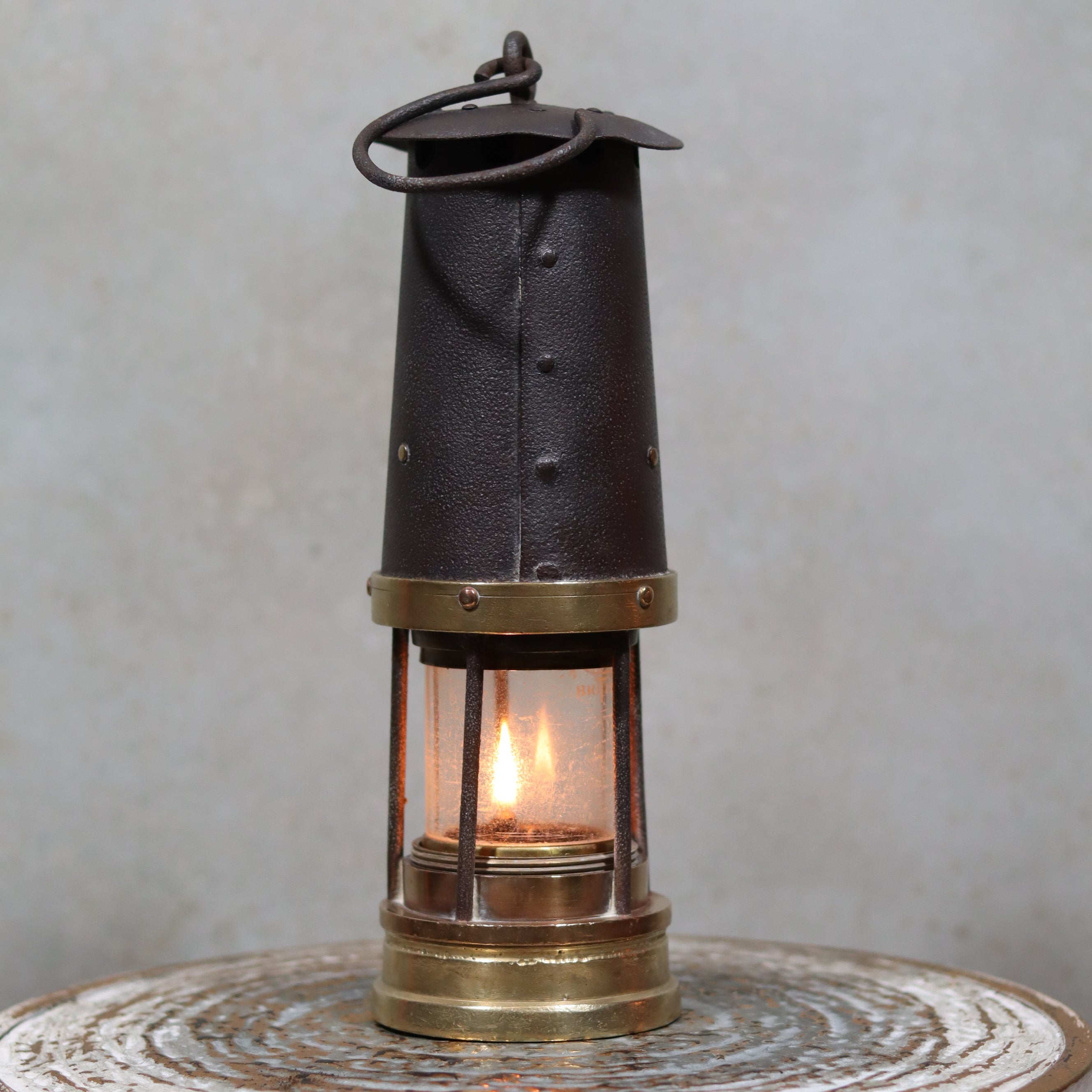 Antique British Mining Lamp – Davies Derby Safety Lamp (Circa 1900) with lit oil flame and metal casing