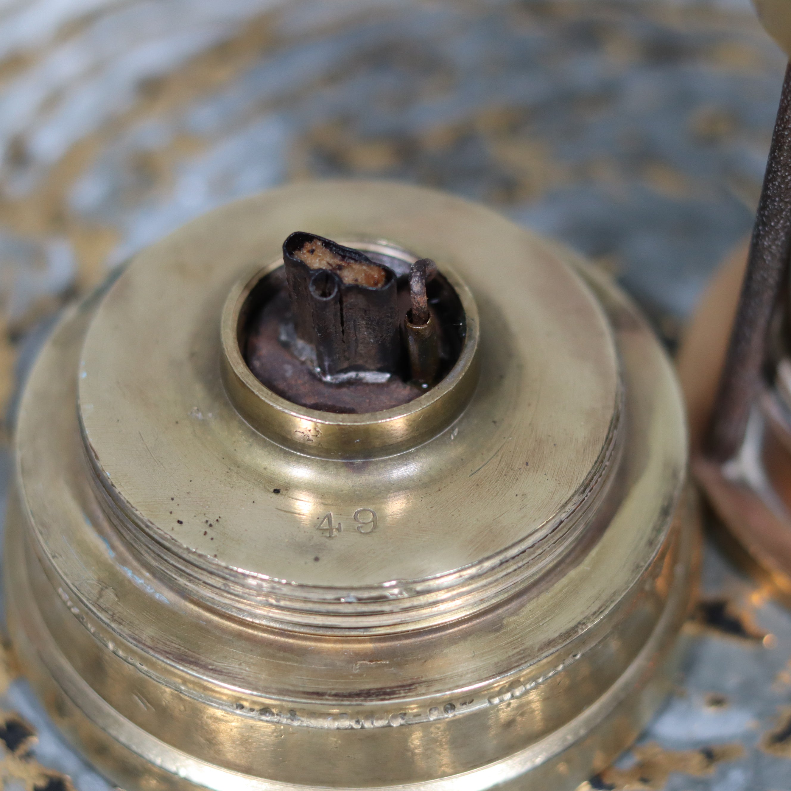 Close-up of the wick and brass top of the Antique British Mining Lamp – Davies Derby Safety Lamp (Circa 1900) oil lamp.