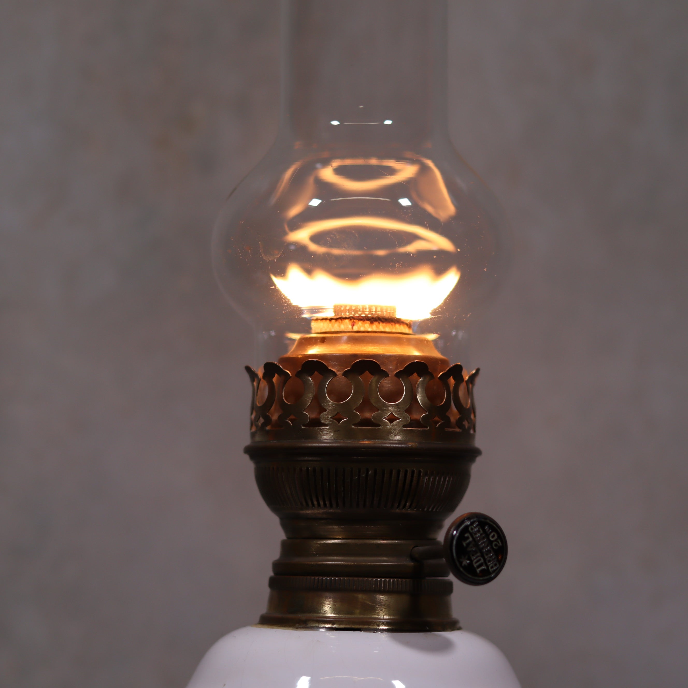 Vintage XXL Oil Lamp with BJB Matador Burner – Bronze Base with Cherub Design lit close-up showcasing the burner details