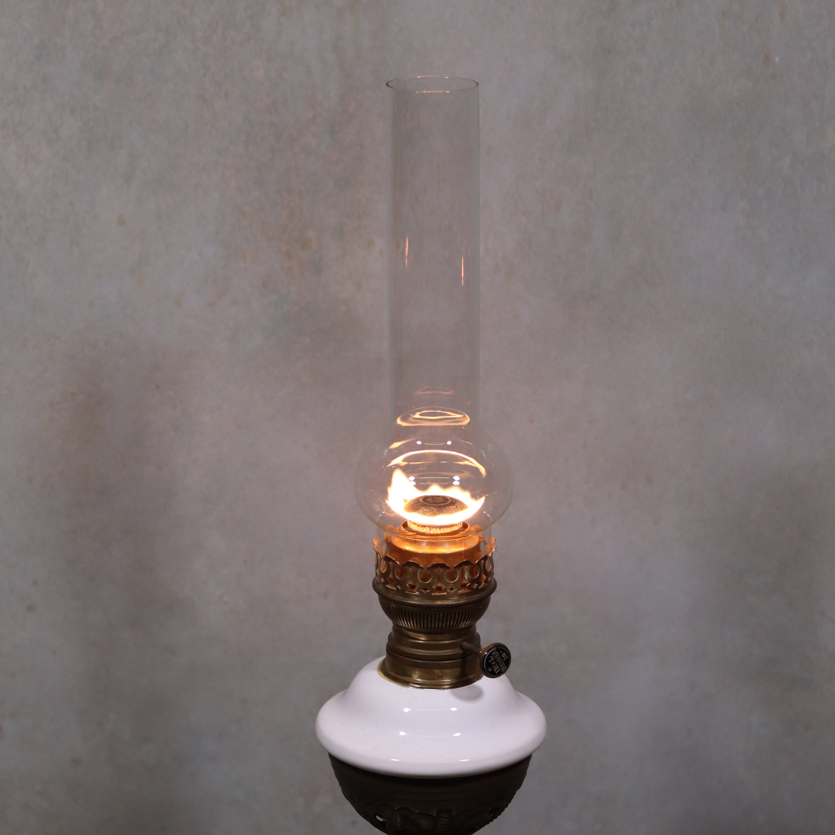 Vintage XXL Oil Lamp with BJB Matador Burner – Bronze Base with Cherub Design lit against neutral background