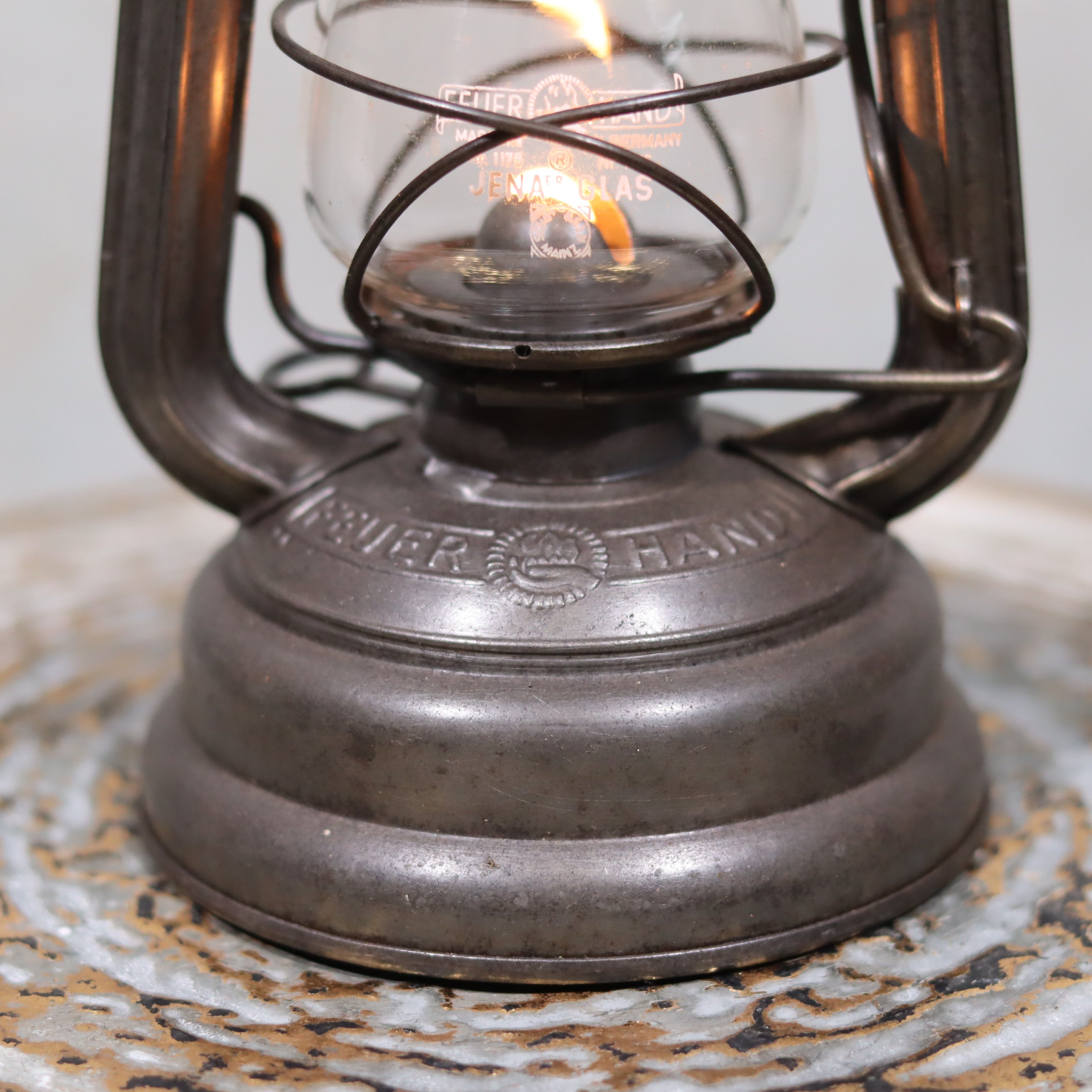 Vintage Feuerhand 176 Storm Lantern – Post-WWII Model, 1950s, Excellent Condition oil lamp with detailed metal base and lit wick
