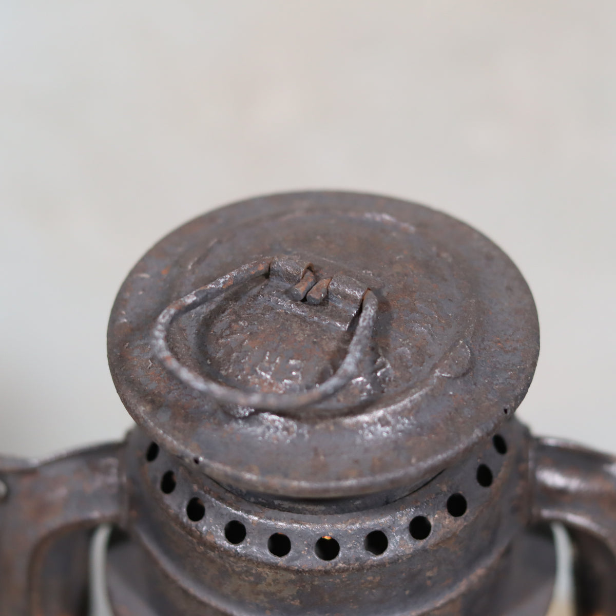 Rare Pre-War Storm Lantern – Feuerhand 275 Superflam, 1930s oil lamp showing rusted metal cap and ventilation holes.