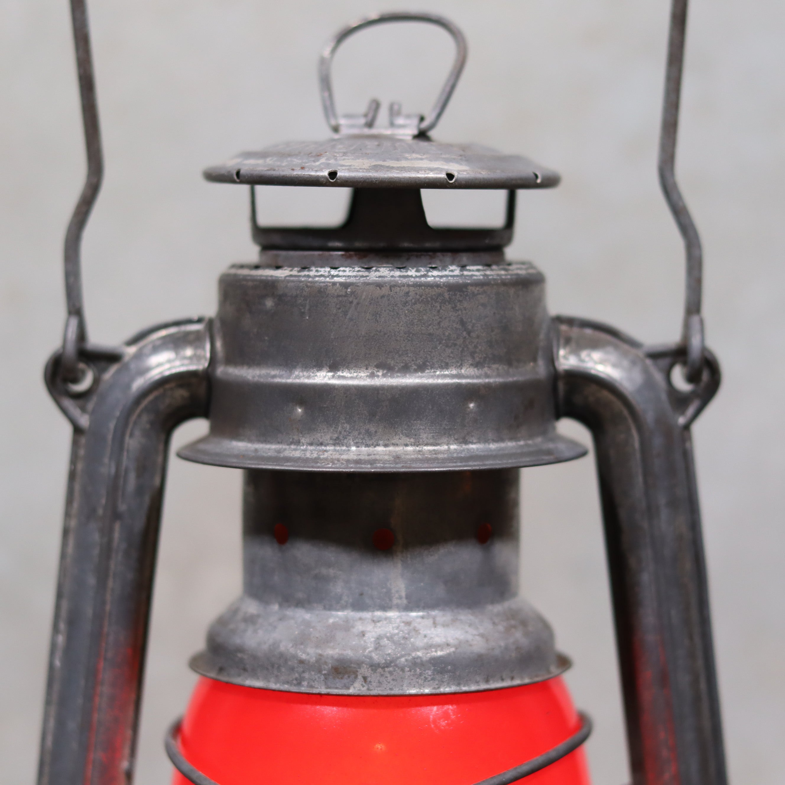 Vintage Feuerhand Baby 275 Hurricane Lantern – Western Germany – Red Glass oil lamp showing metal top and red glass body close-up