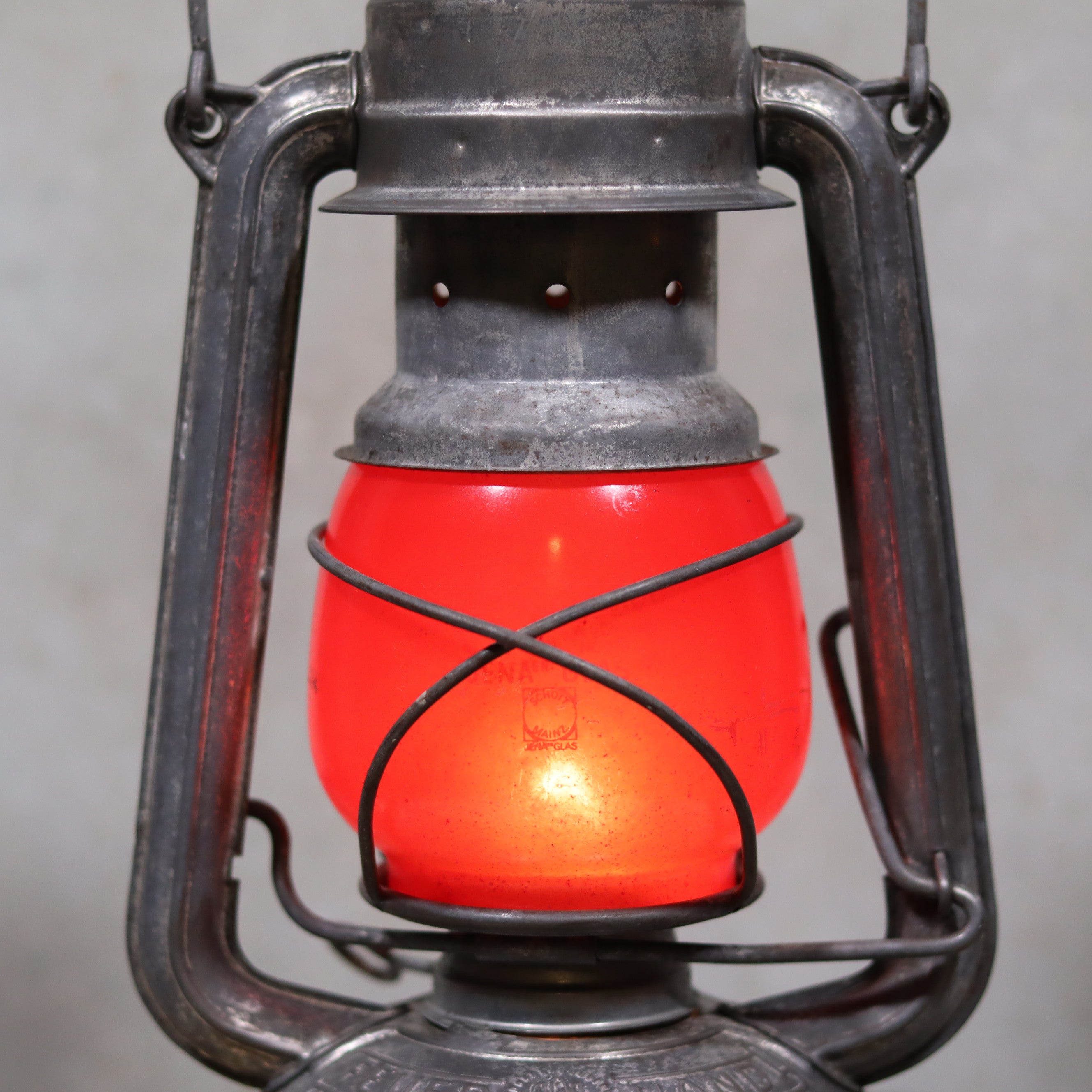 Vintage Feuerhand Baby 275 Hurricane Lantern – Western Germany – Red Glass oil lamp with rustic metal frame and glowing red glass shade