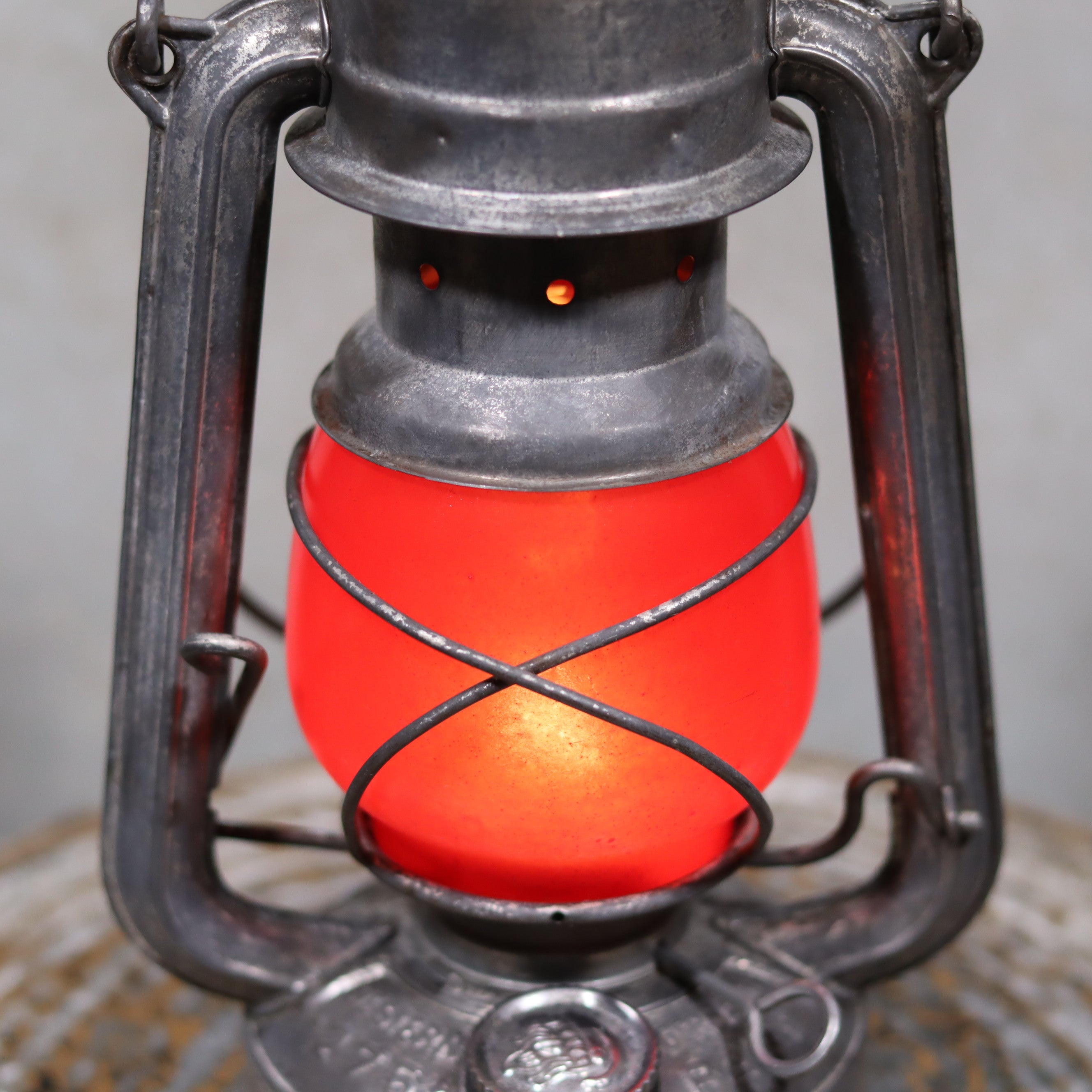 Vintage Feuerhand Baby 275 Hurricane Lantern – Western Germany – Red Glass oil lamp with metal frame and glowing red glass globe