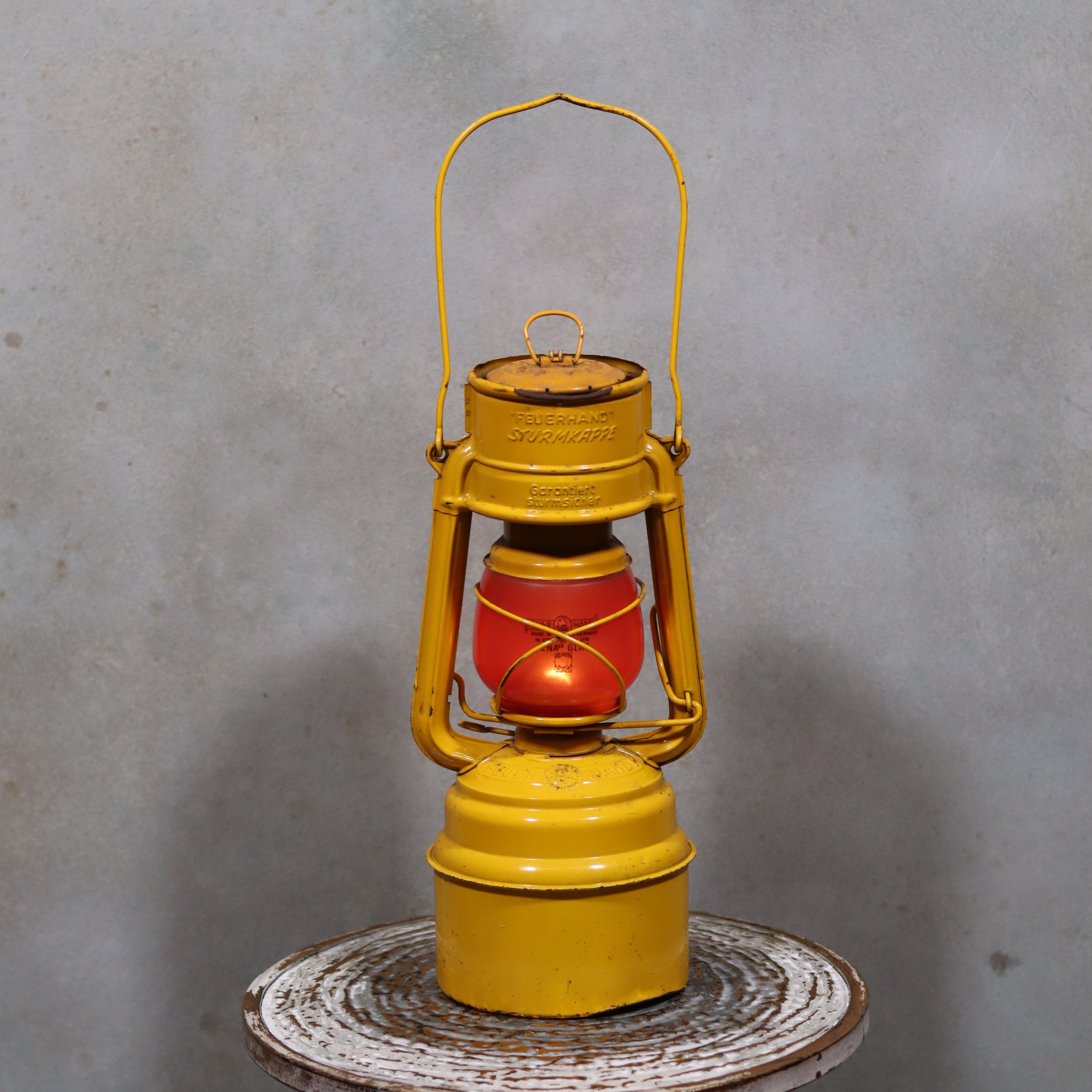 Vintage Feuerhand Hurricane Lantern – Baby Special 276 STK/70 safety oil lamp with yellow frame and red glass globe design