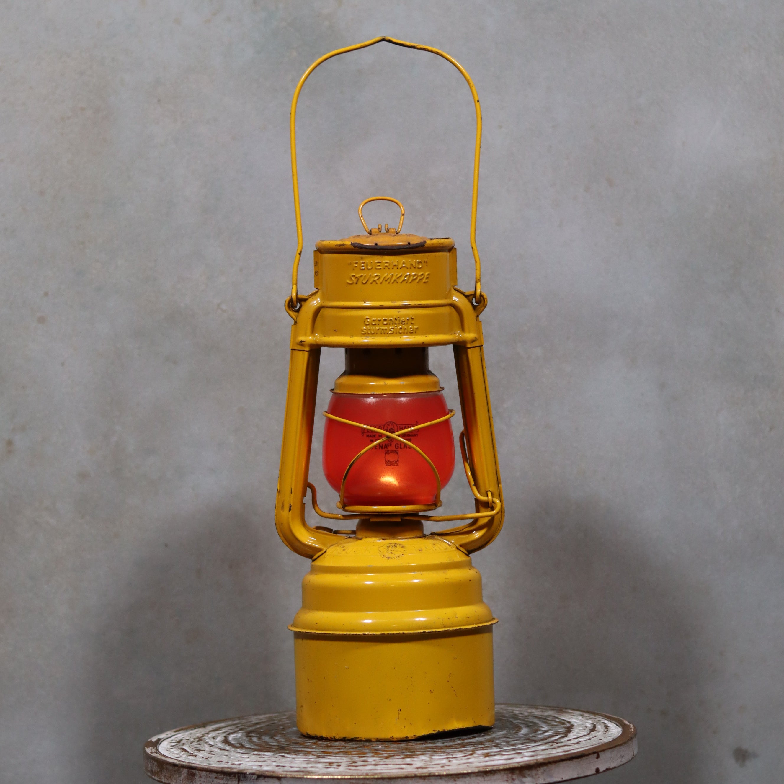 Vintage Feuerhand Hurricane Lantern – Baby Special 276 STK/70 showing classic yellow and red oil lamp design by Feuerhand brand