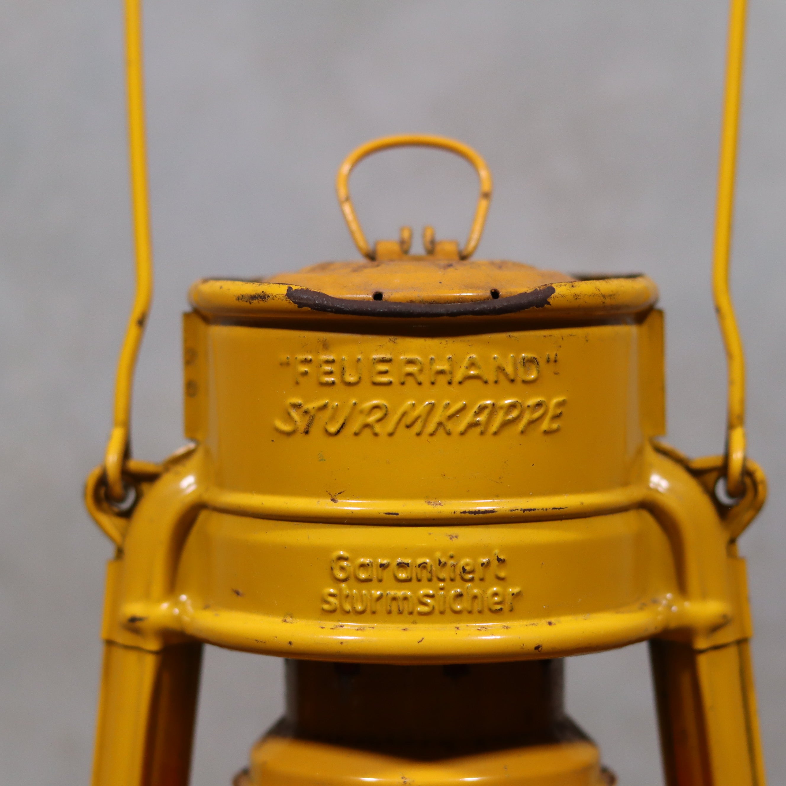 Vintage Feuerhand Hurricane Lantern – Baby Special 276 STK/70 showing close-up of durable oil lamp brand engraving and metal design