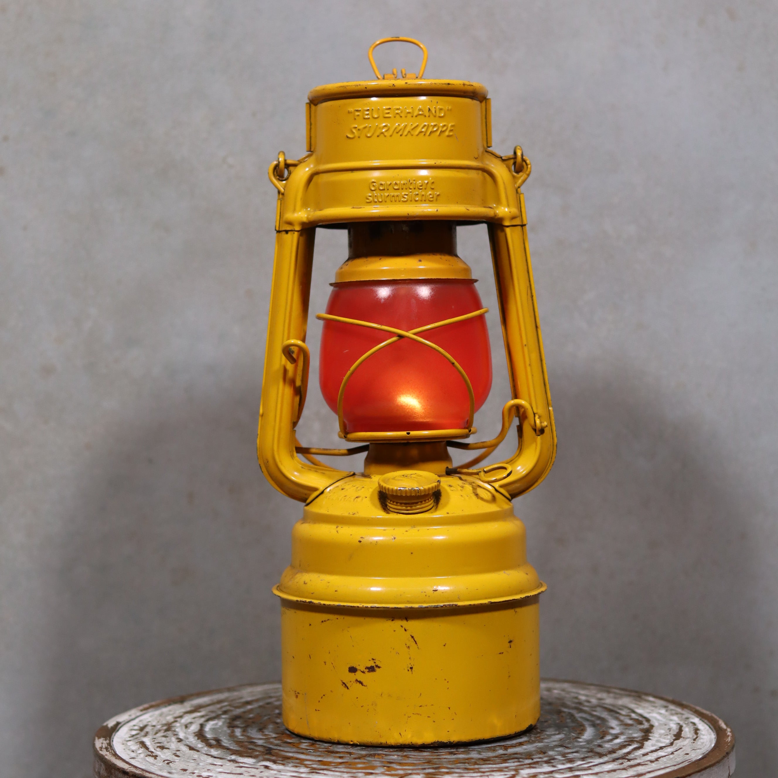 Vintage Feuerhand Hurricane Lantern – Baby Special 276 STK/70 oil lamp in yellow with red globe, classic German safety lantern design