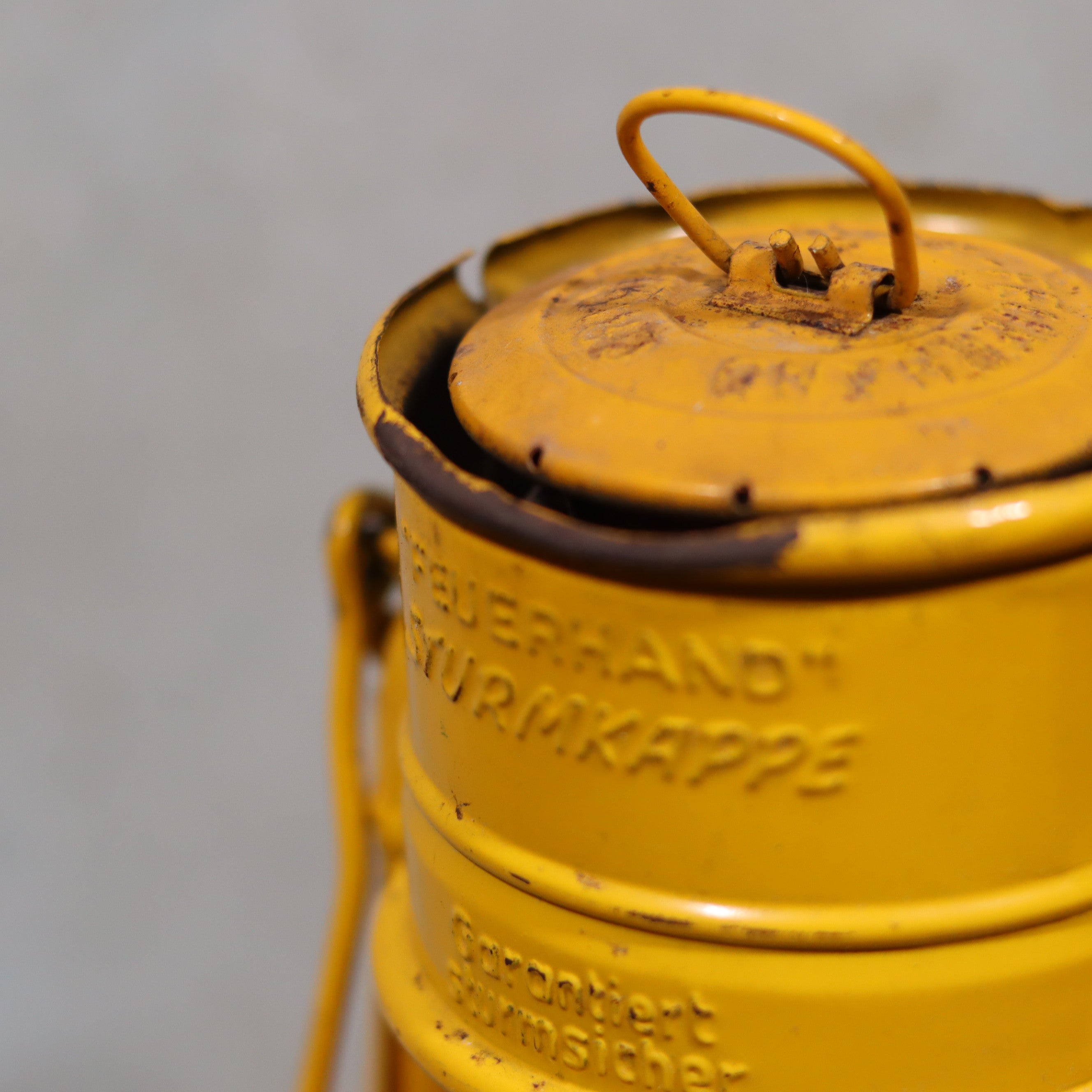 Close-up of a yellow oil lamp from the Vintage Feuerhand Hurricane Lantern – Baby Special 276 STK/70 Safety Lantern series