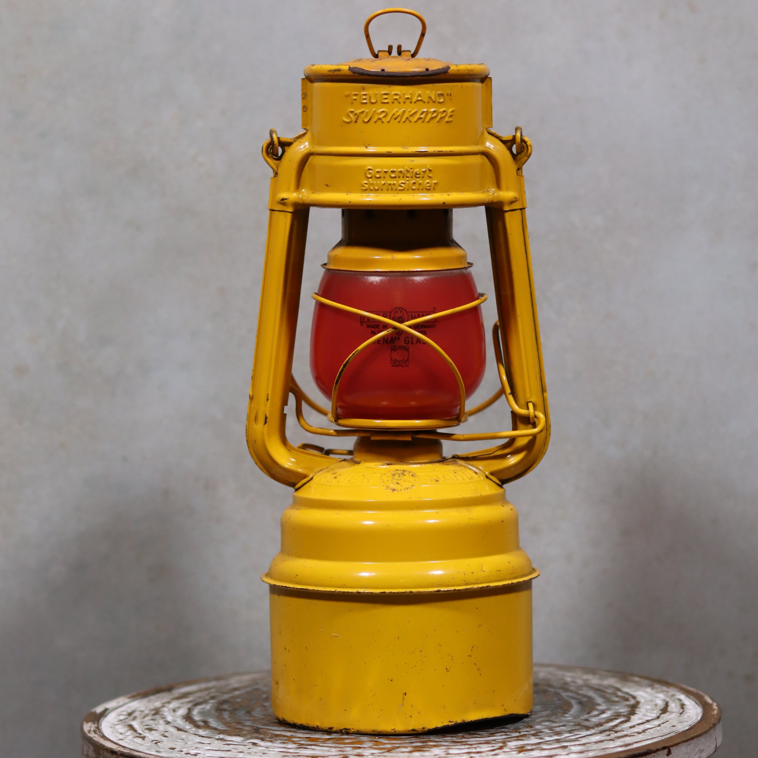 Vintage Feuerhand Hurricane Lantern – Baby Special 276 STK/70 with yellow metal body and red glass oil lamp design